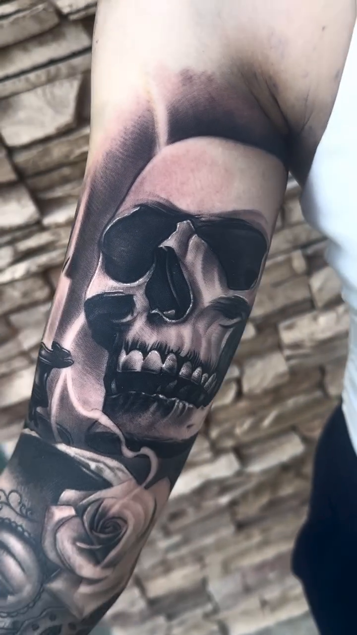 Skulls and roses realism tattoo by Tattoo