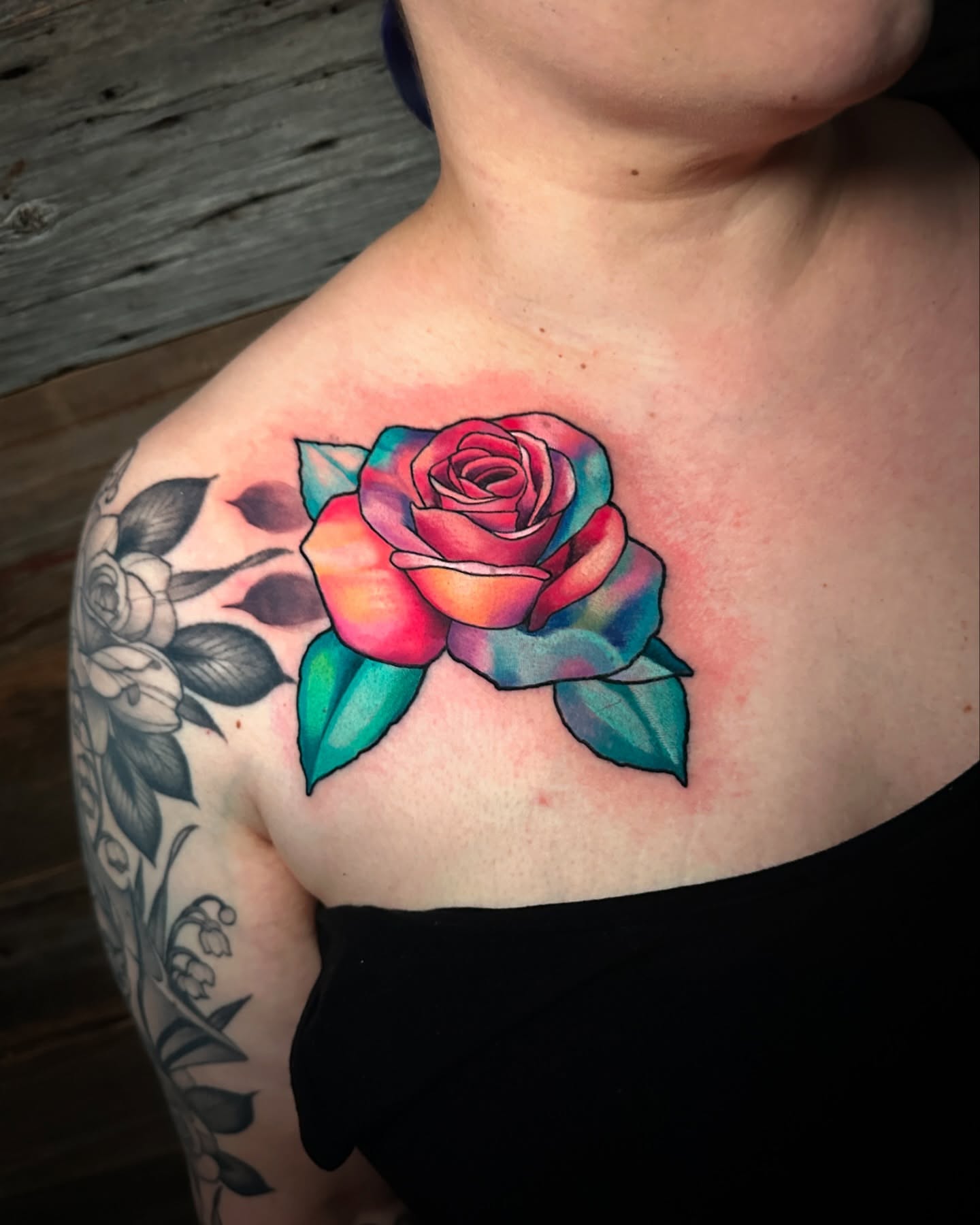 Rose new school tattoo on the chest by Joe Friedman