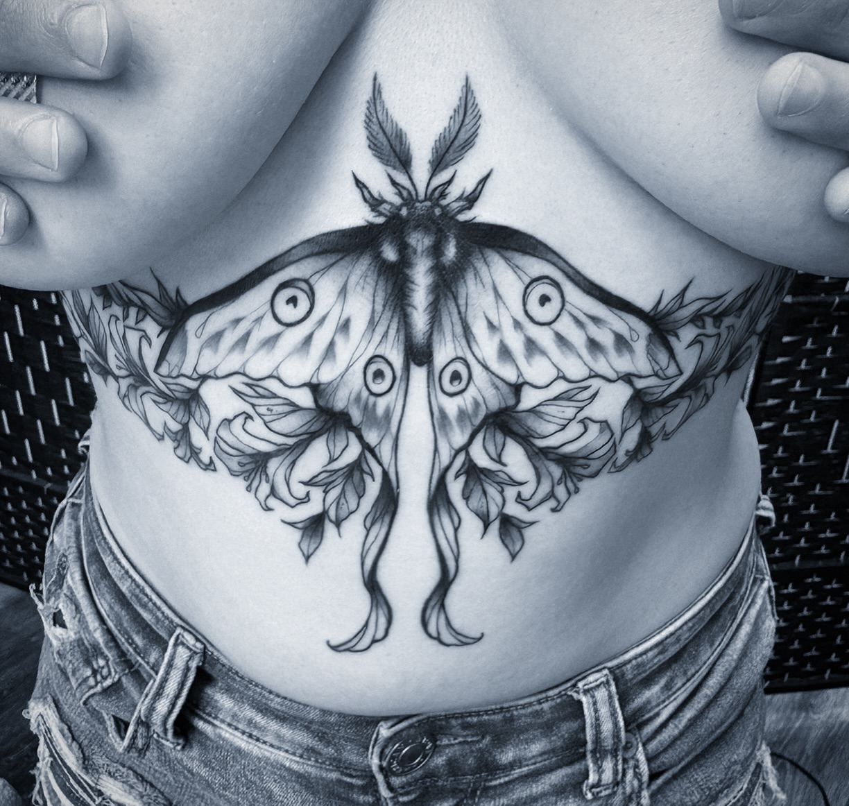 Moth realism tattoo on the ribs by Michael Langdale