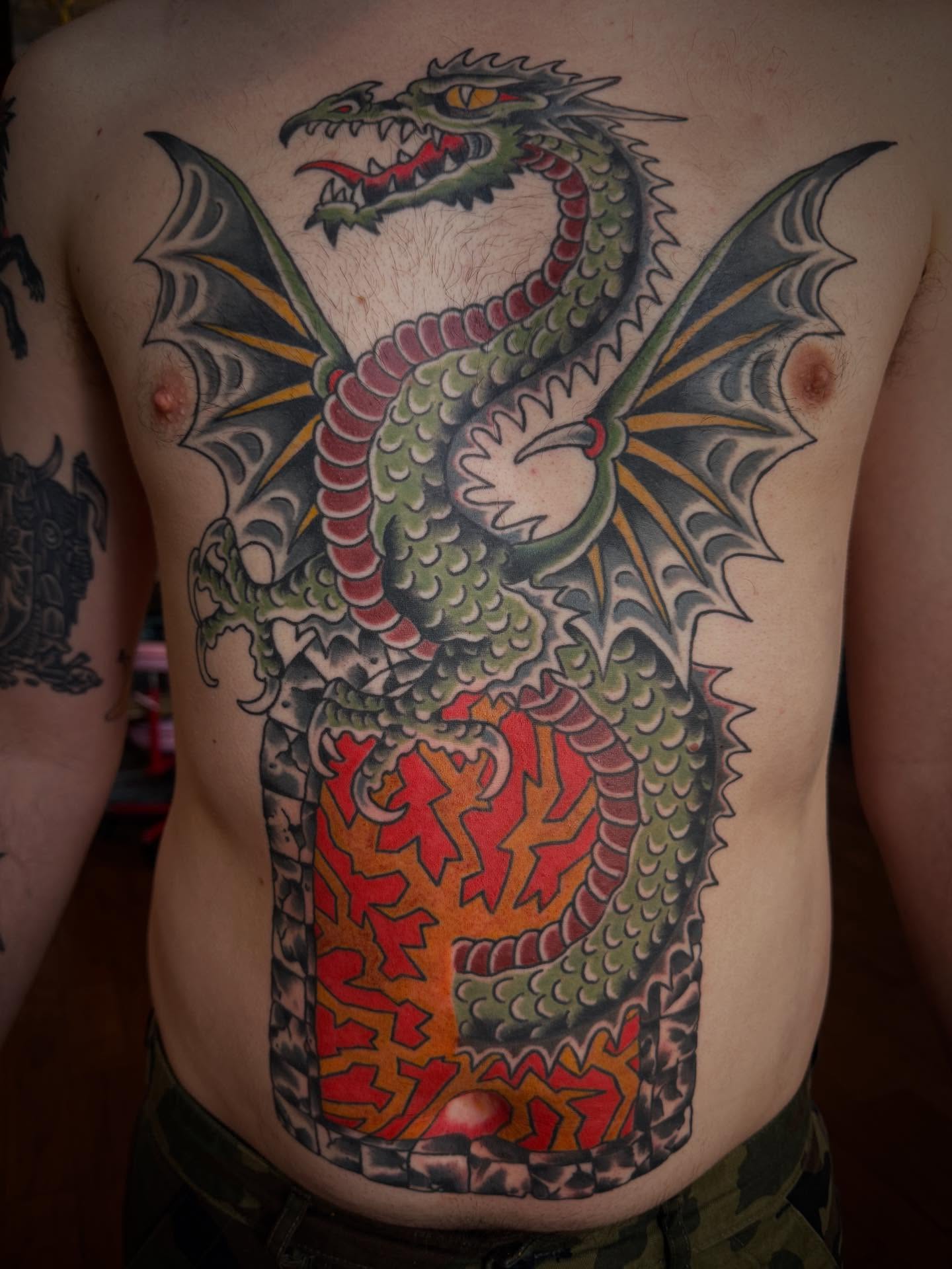 Dragon American traditional tattoo on the back by Jesse Swanson, Santa Rosa, California