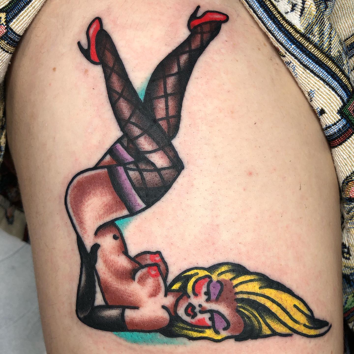 Woman in stockings American traditional tattoo on the thigh by Tattoo