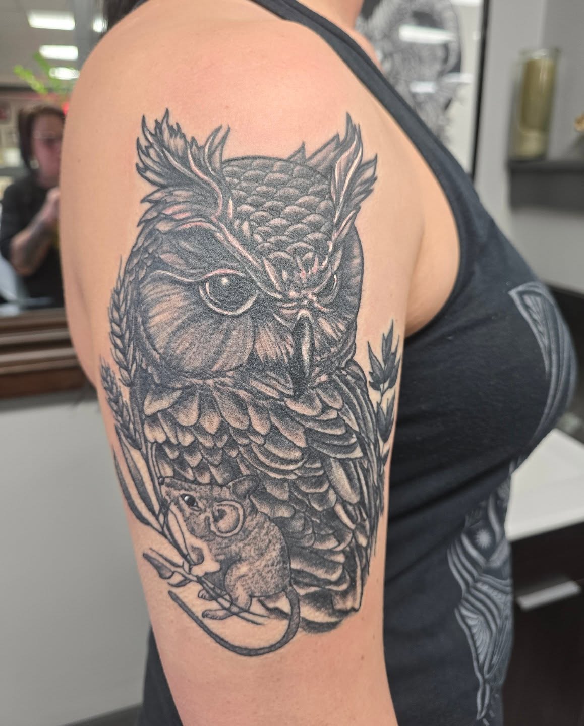 Owl and mouse realism tattoo on the upper arm by Karen Cain