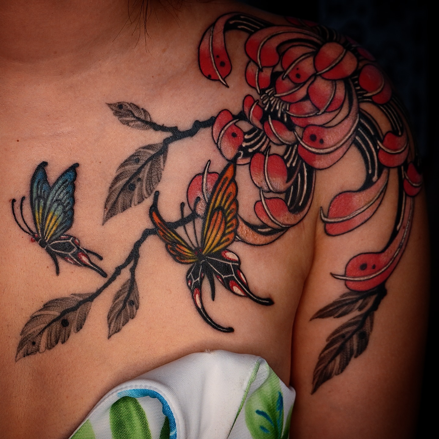 Cherry blossoms and butterflies American traditional tattoo on the shoulder by 吳盈慧, Los Angeles, California