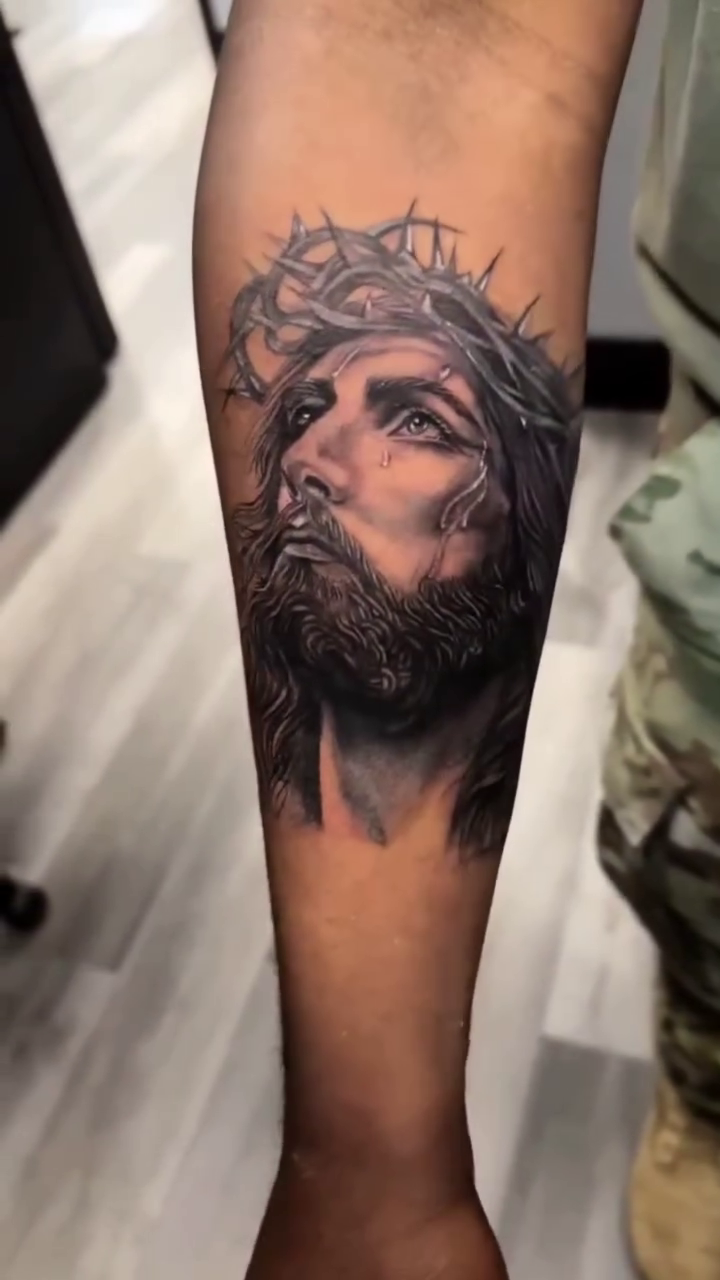 Jesus Christ portrait Chicano tattoo on the forearm by William Gualteros