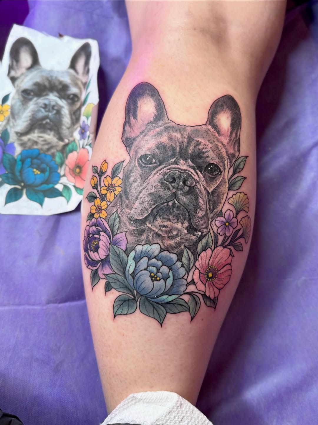 French Bulldog with flowers realism tattoo on the thigh by Maggie George