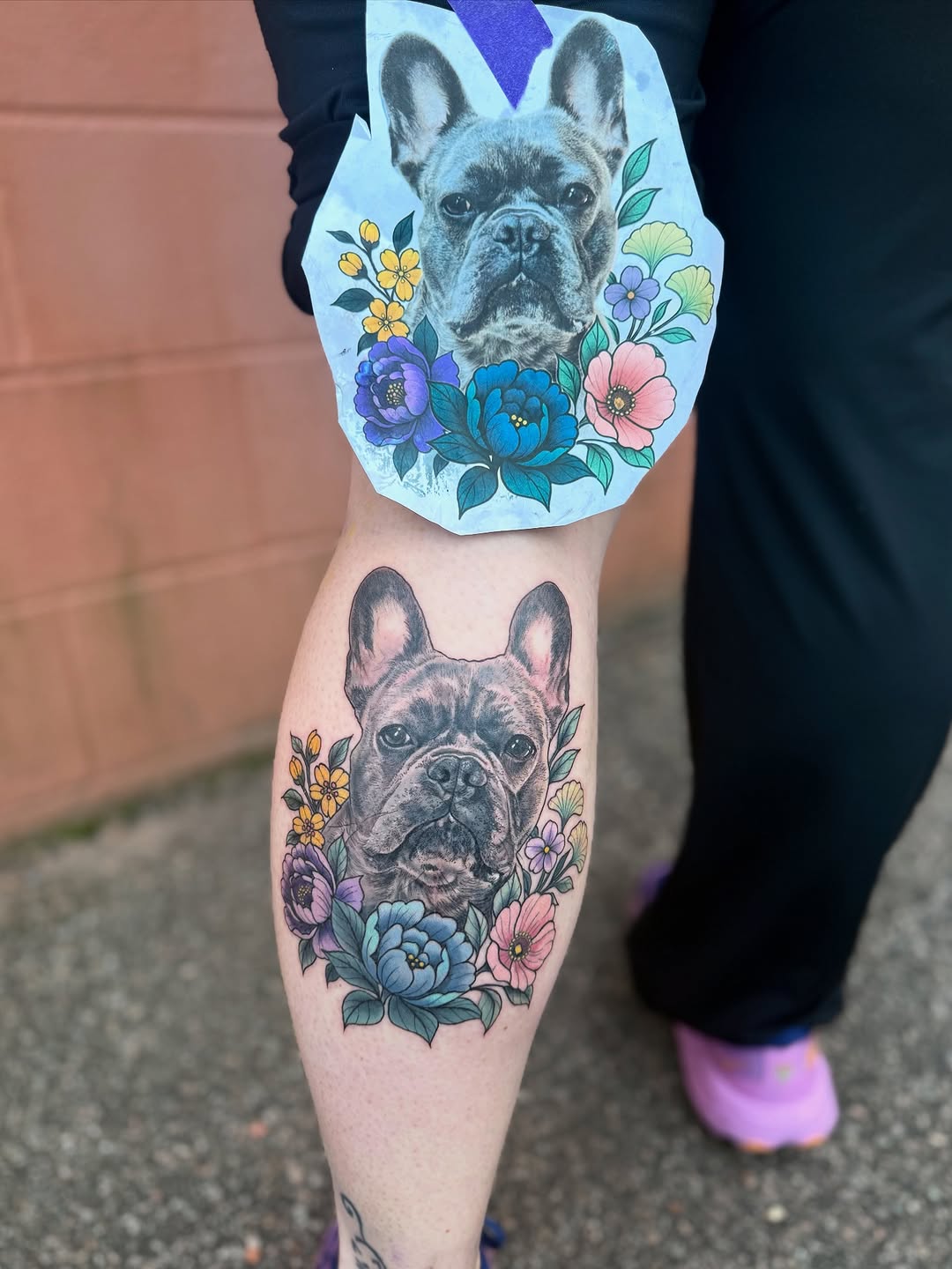 French bulldog with flowers realism tattoo on the forearm by Maggie George