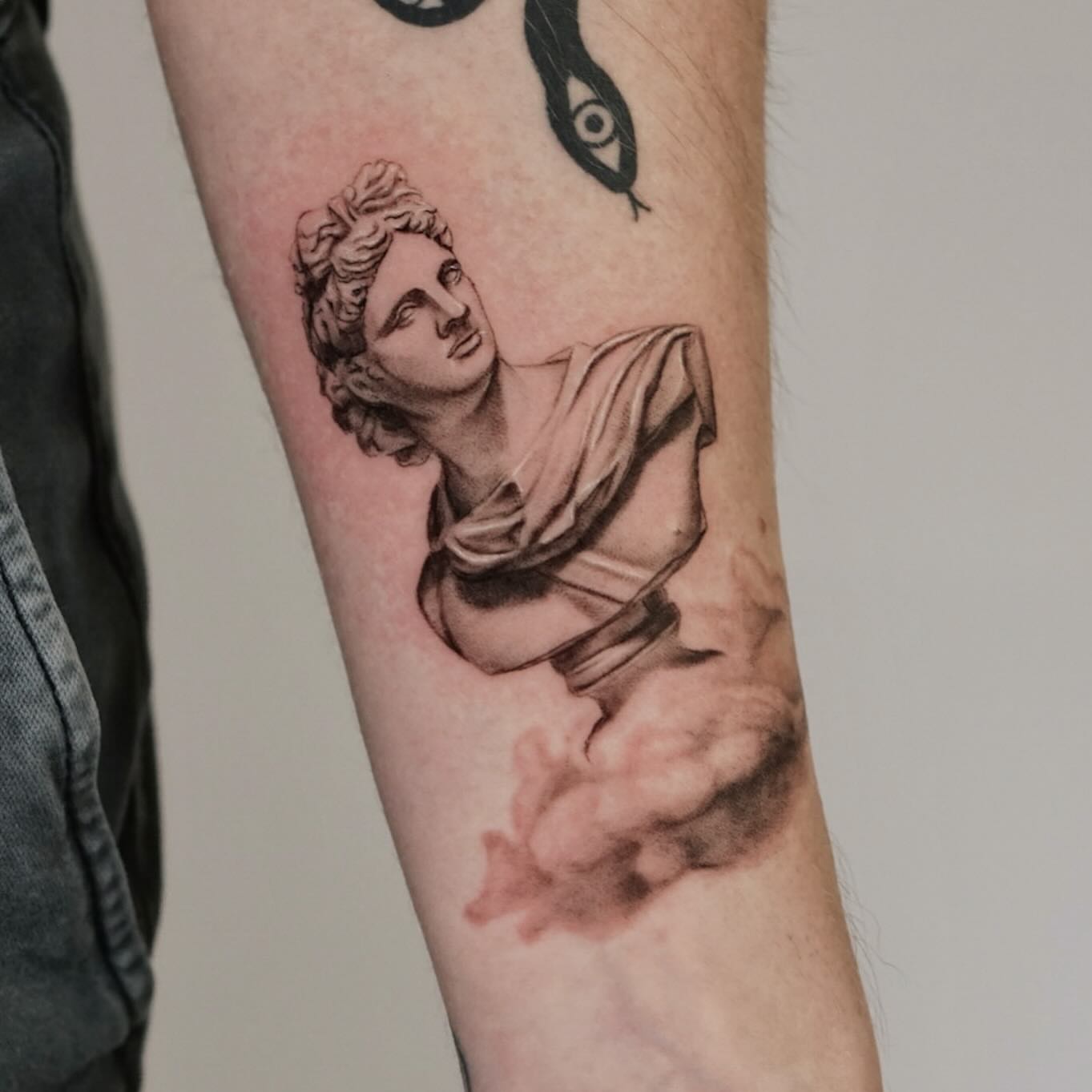 Statue black and grey tattoo on the forearm by Longtea