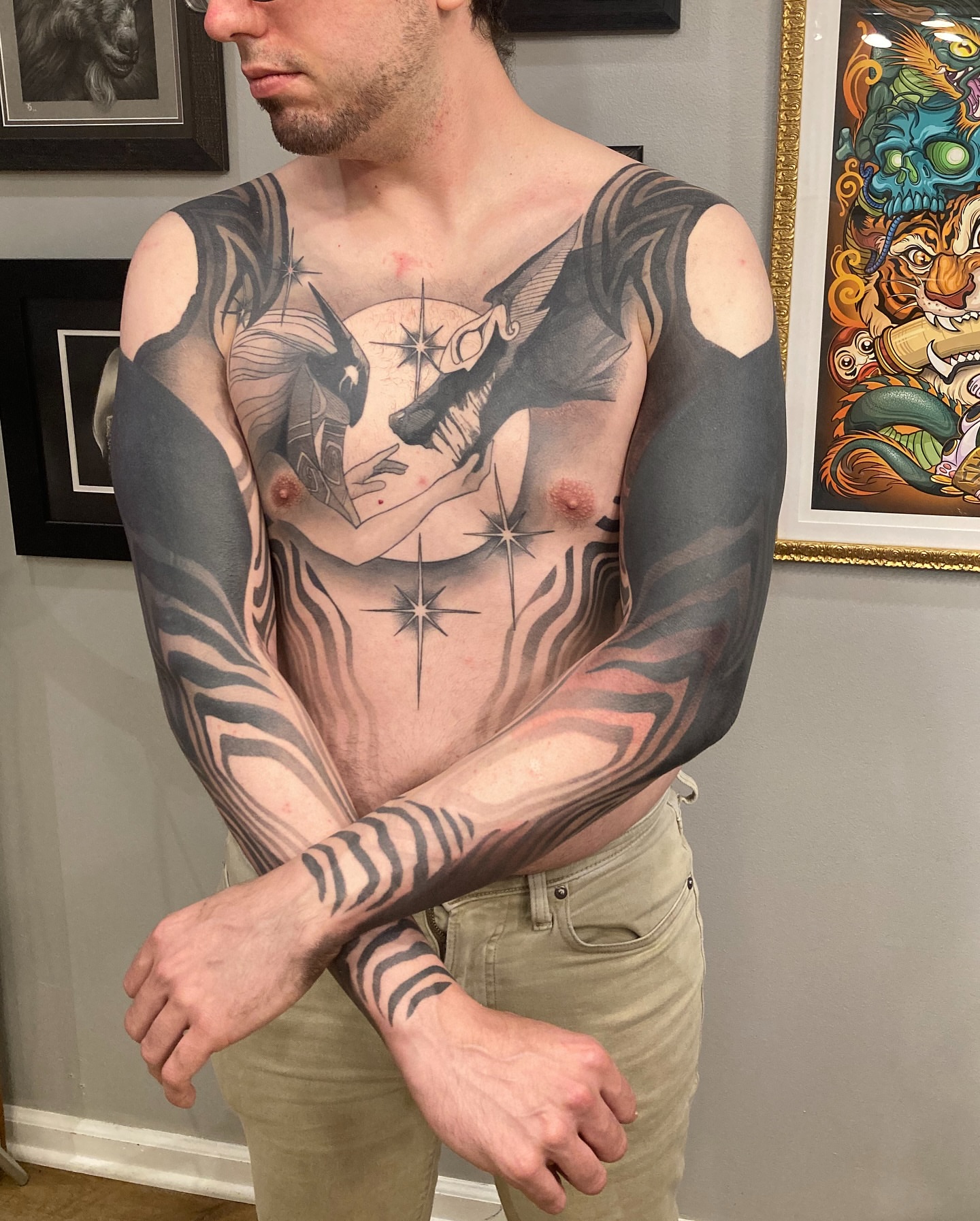 Wolf and stars realism tattoo on the chest by Rizzie D'Alterio
