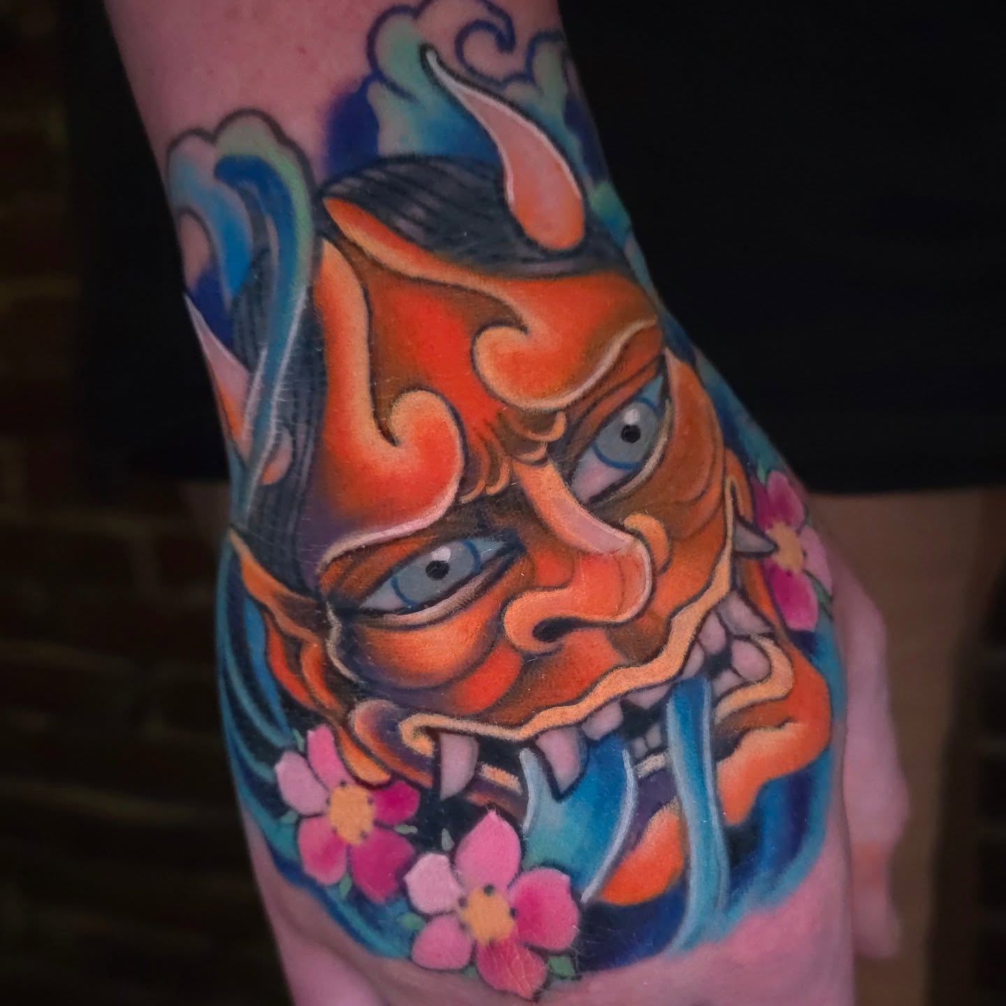 Mask with flowers japanese irezumi tattoo on the forearm by Joseph Jeffers