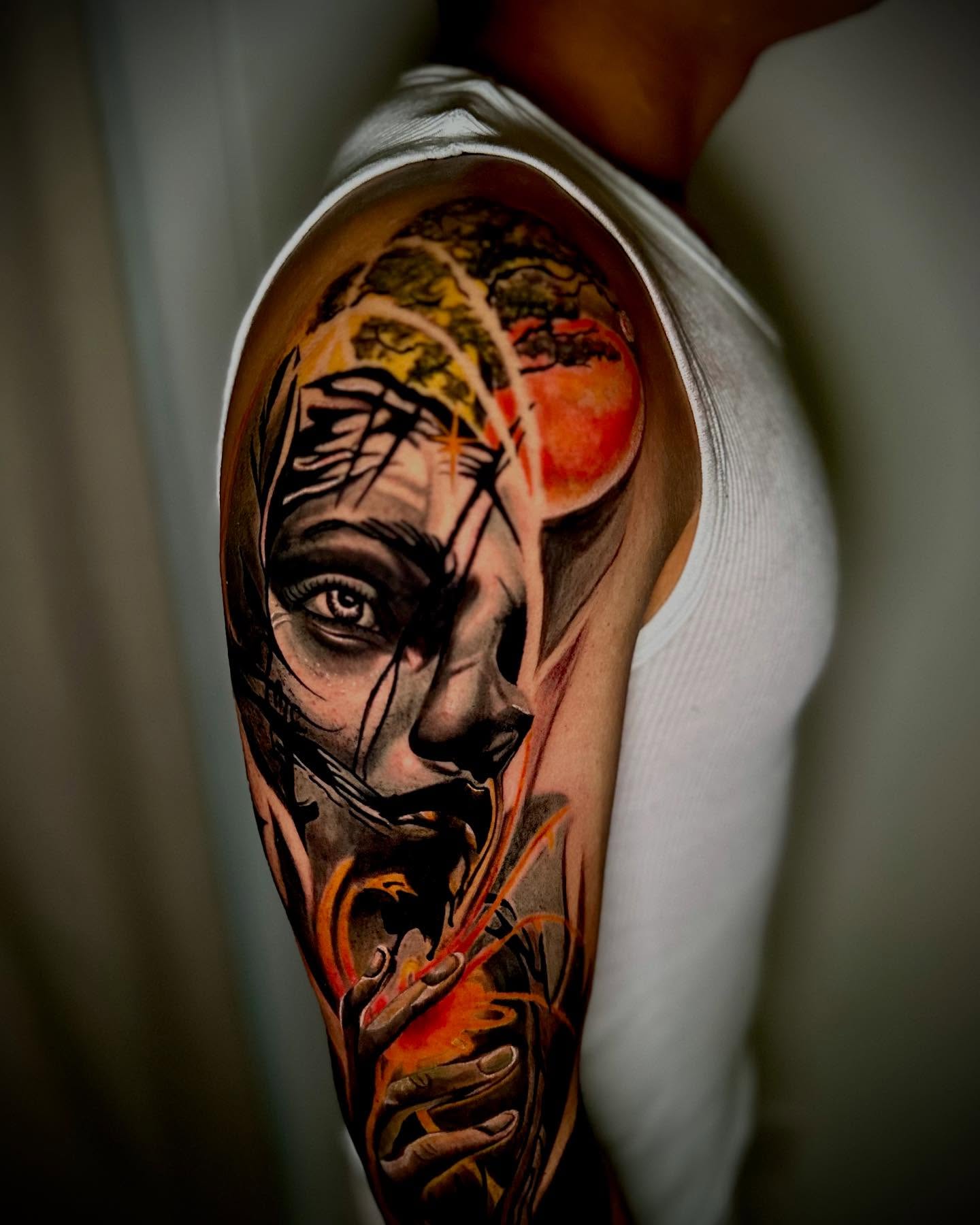 Portrait realism tattoo on the upper arm by Daniel Ruiz