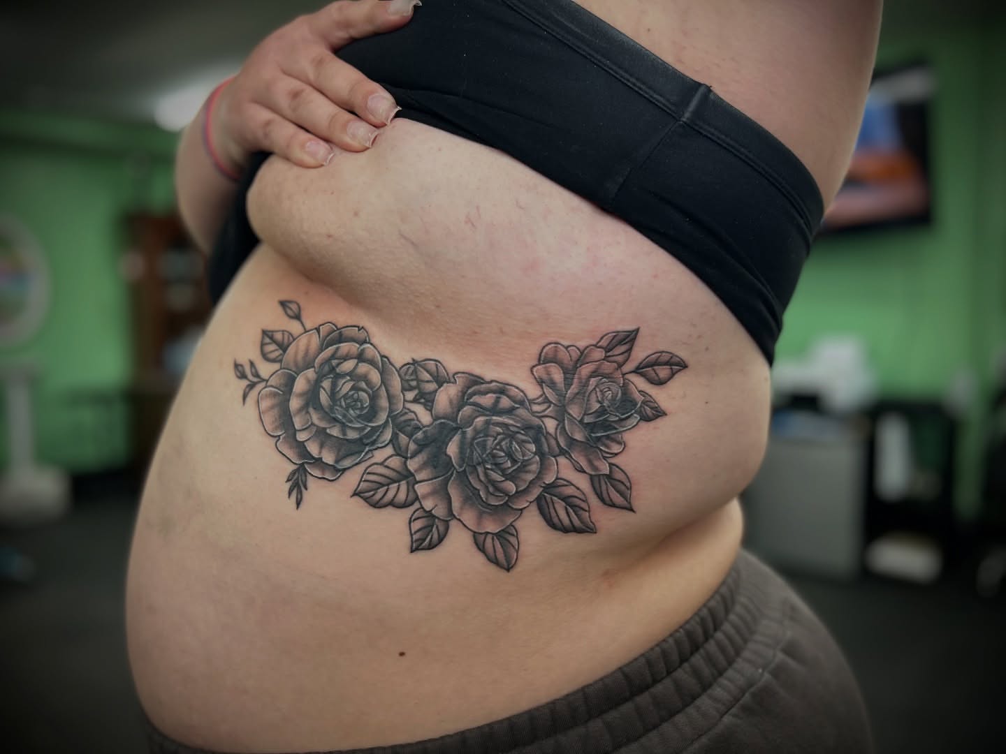 Roses black and grey tattoo on the ribs by Kiersten Tickle