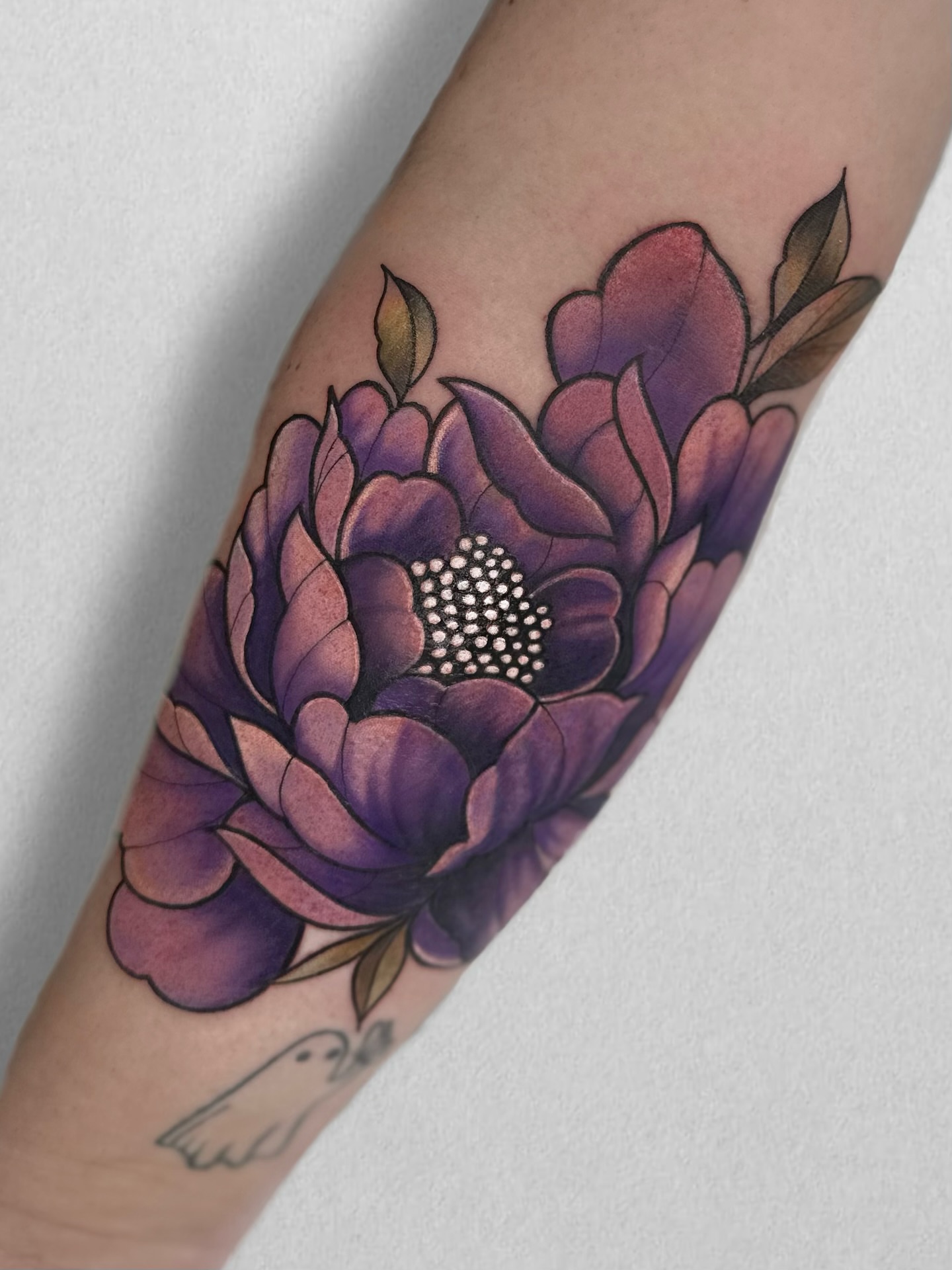 Purple flower dotwork tattoo on the forearm by Aris