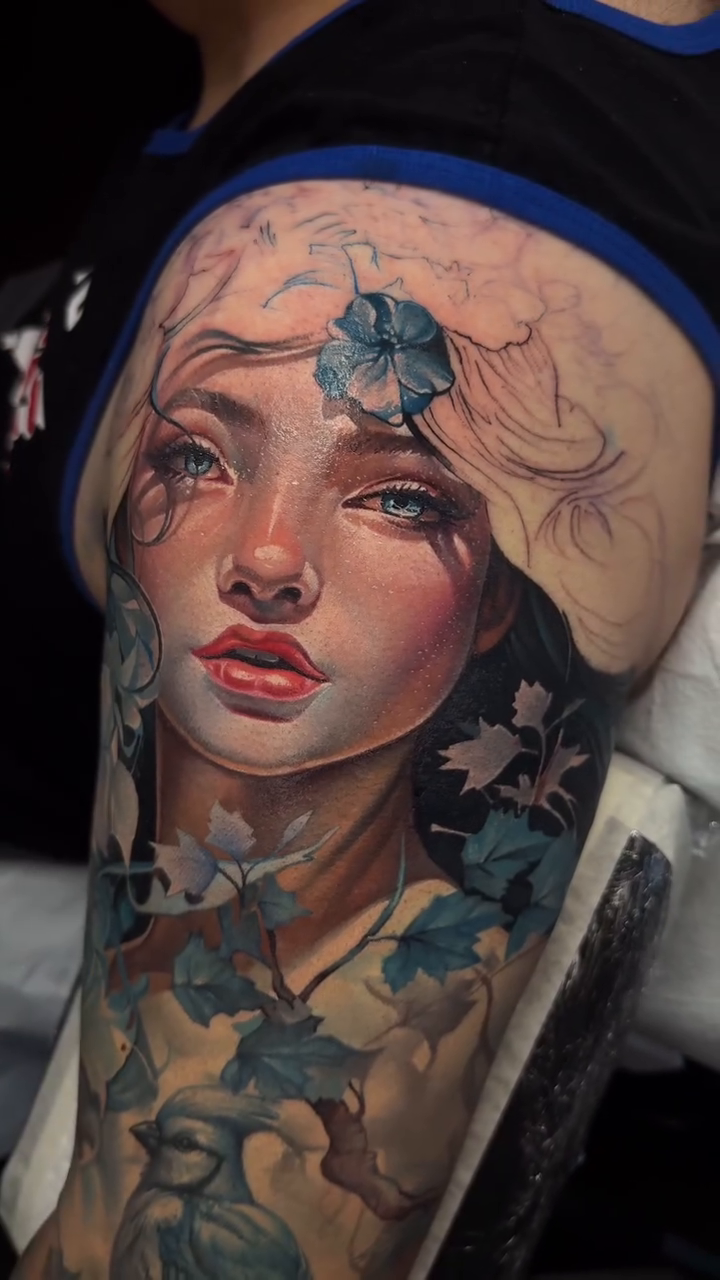 Portrait of a woman with flowers realism tattoo on the chest by Dmitriy Paramonov πΊπ¦