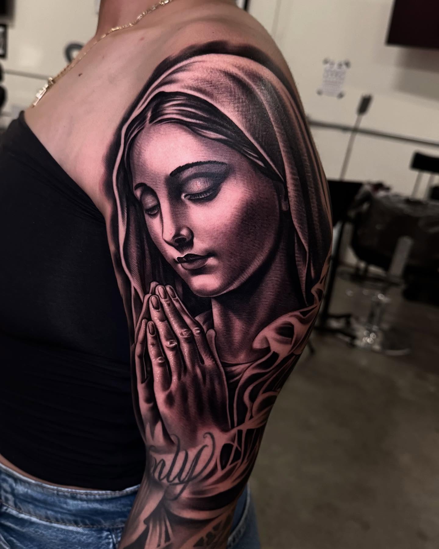 Praying woman realism tattoo on the shoulder by eksoe_