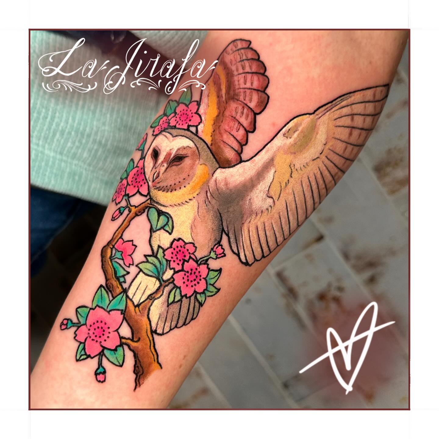 Owl and cherry blossoms realism tattoo on the forearm by Marta La Jirafa