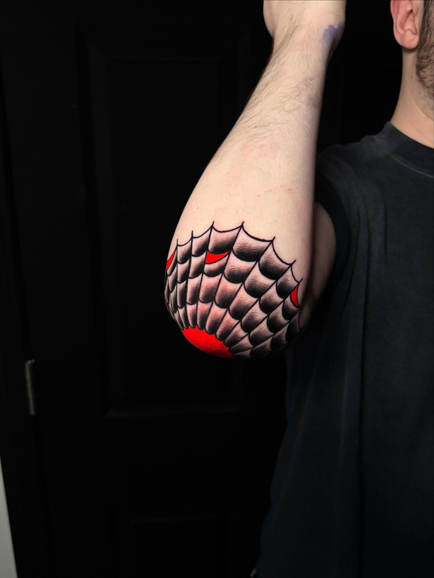 Spiderweb geometric tattoo on the forearm by Nate Masi