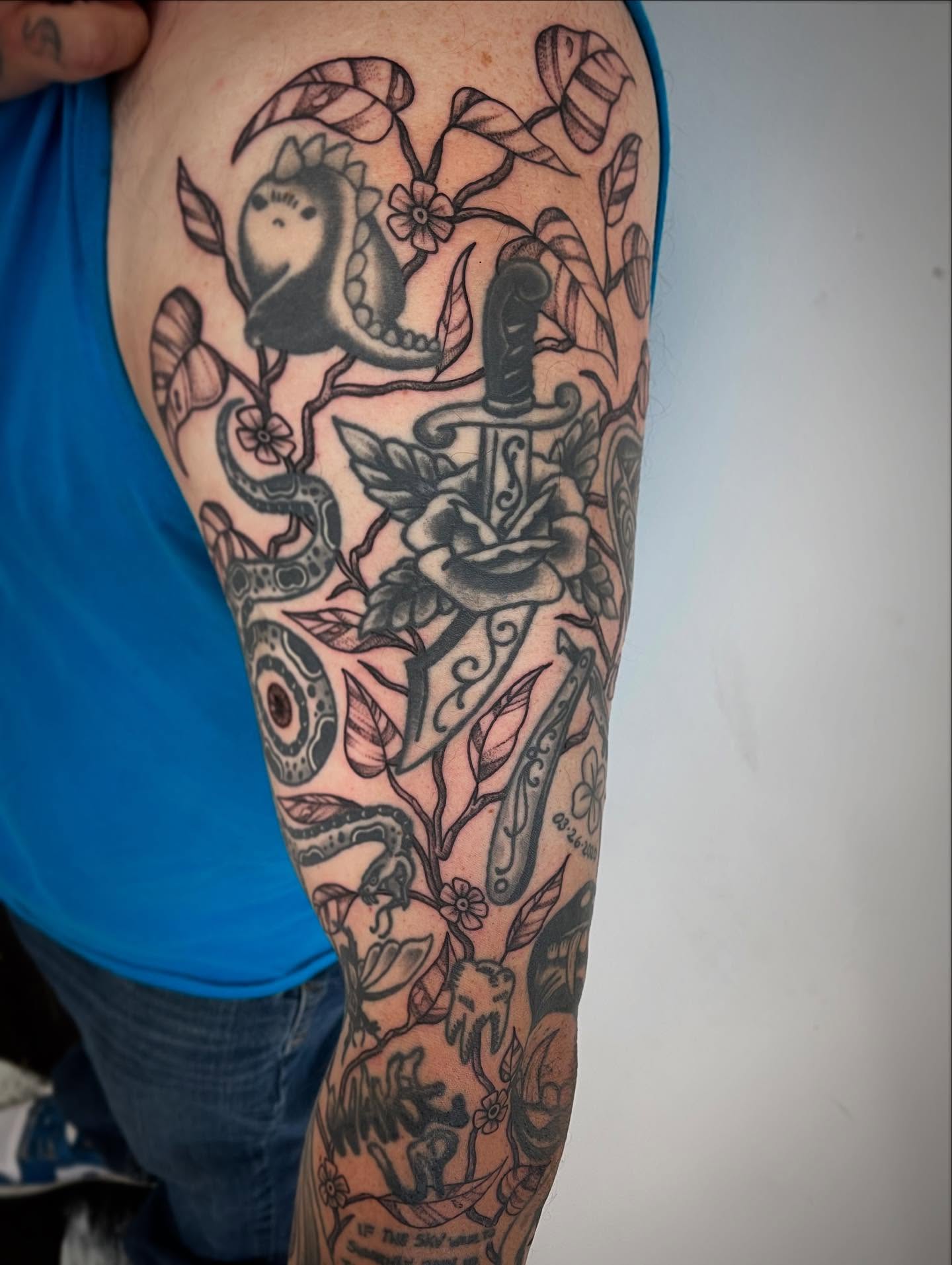 Bird, dagger, rose neo-traditional tattoo on the forearm by Miesha Busker