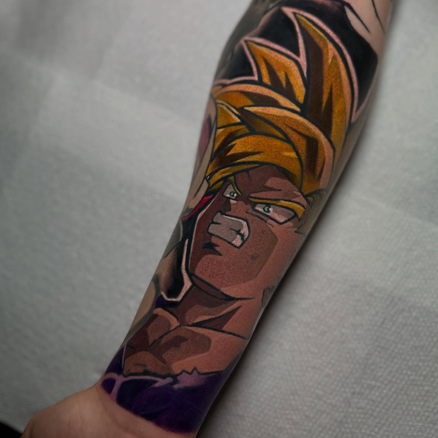 Super saiyan anime tattoo on the forearm by zackery simpson
