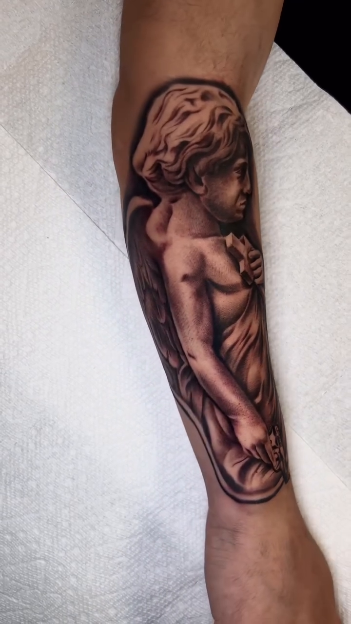 Angelic figure realism tattoo by Kevyn Vidal