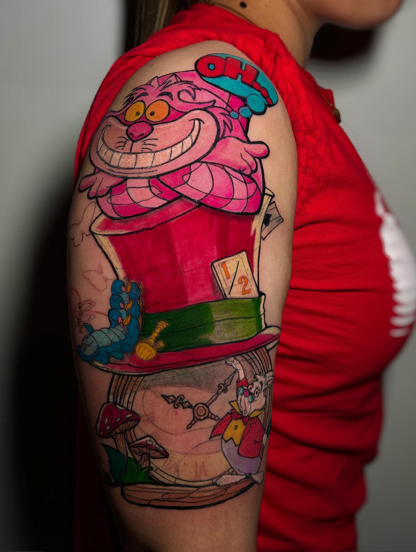 Cheshire cat new school tattoo on the upper arm by ⚜️Dub Aizpurua⚜️
