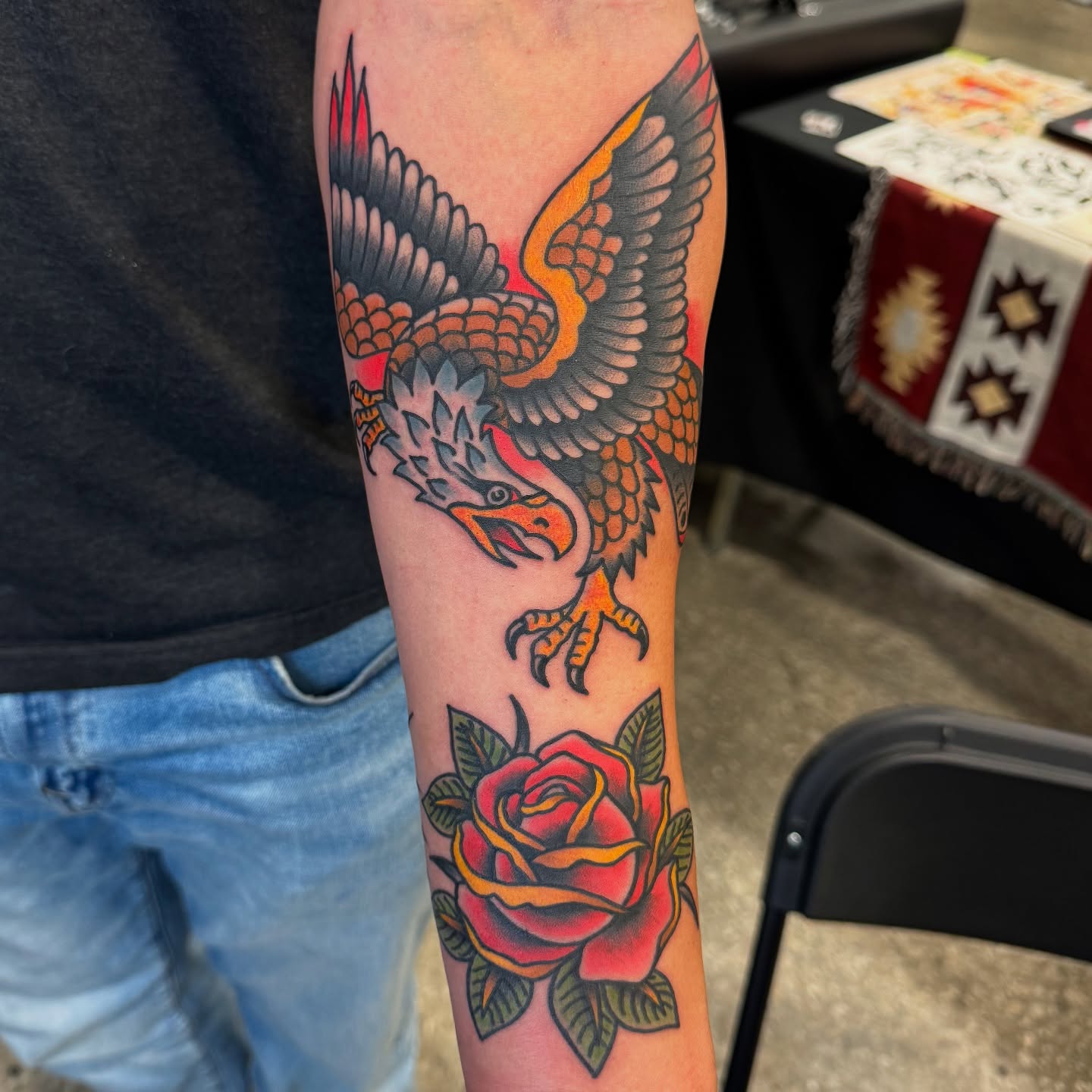 Eagle and rose American traditional tattoo on the forearm by kenneth nash