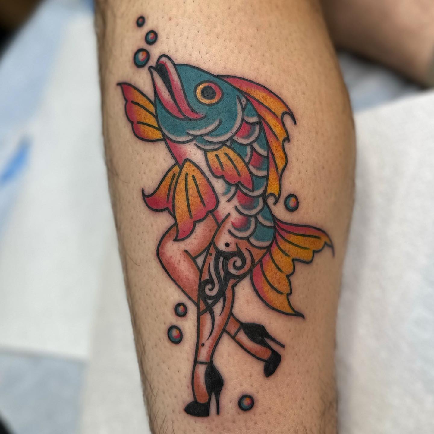 Fish American traditional tattoo on the forearm by Alexa Wolfkiel