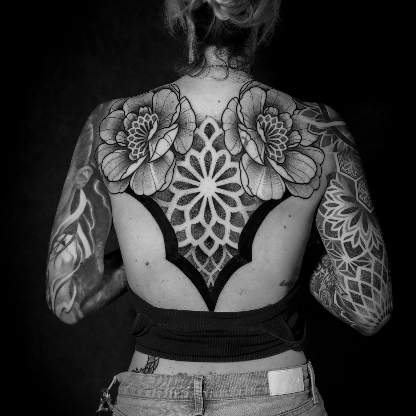 Geometric mandala with floral accents geometric tattoo on the back by Donovan hernandez