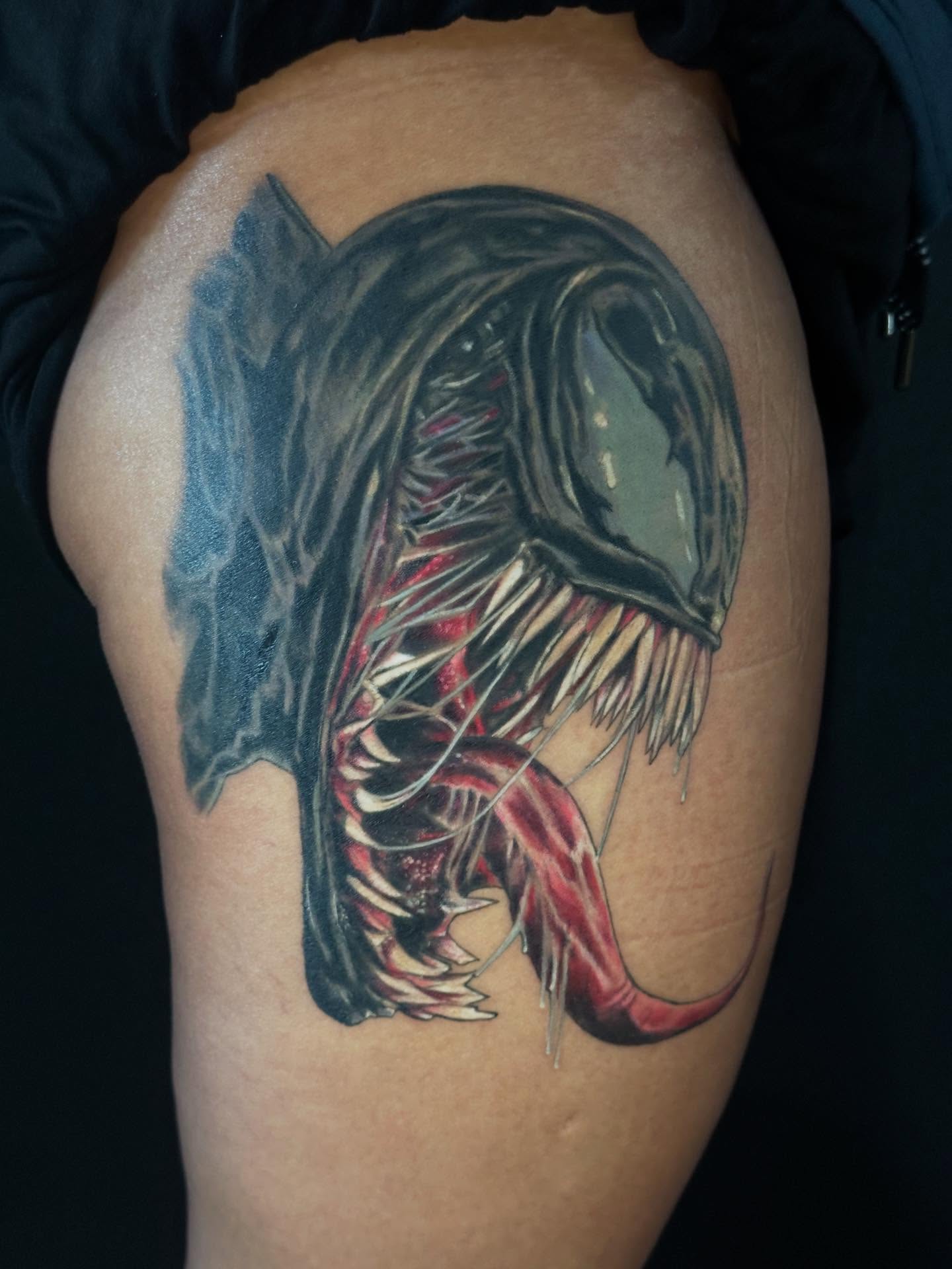 Venom dark realism tattoo on the thigh by George Zabala, Rockdale, Illinois
