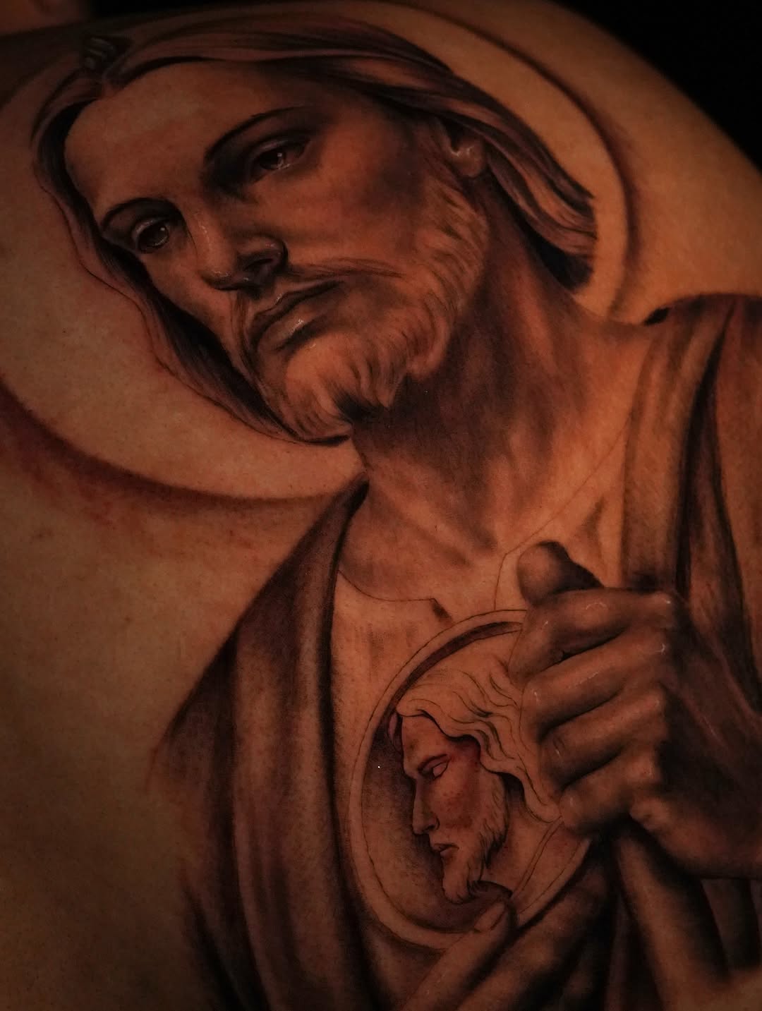 Jesus Christ portrait realism tattoo on the chest by Jennifer Garcia