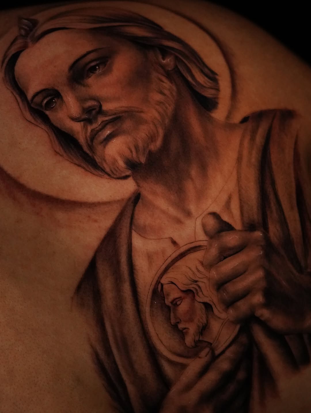 Religious figure portrait realism tattoo on the shoulder by Jennifer Garcia