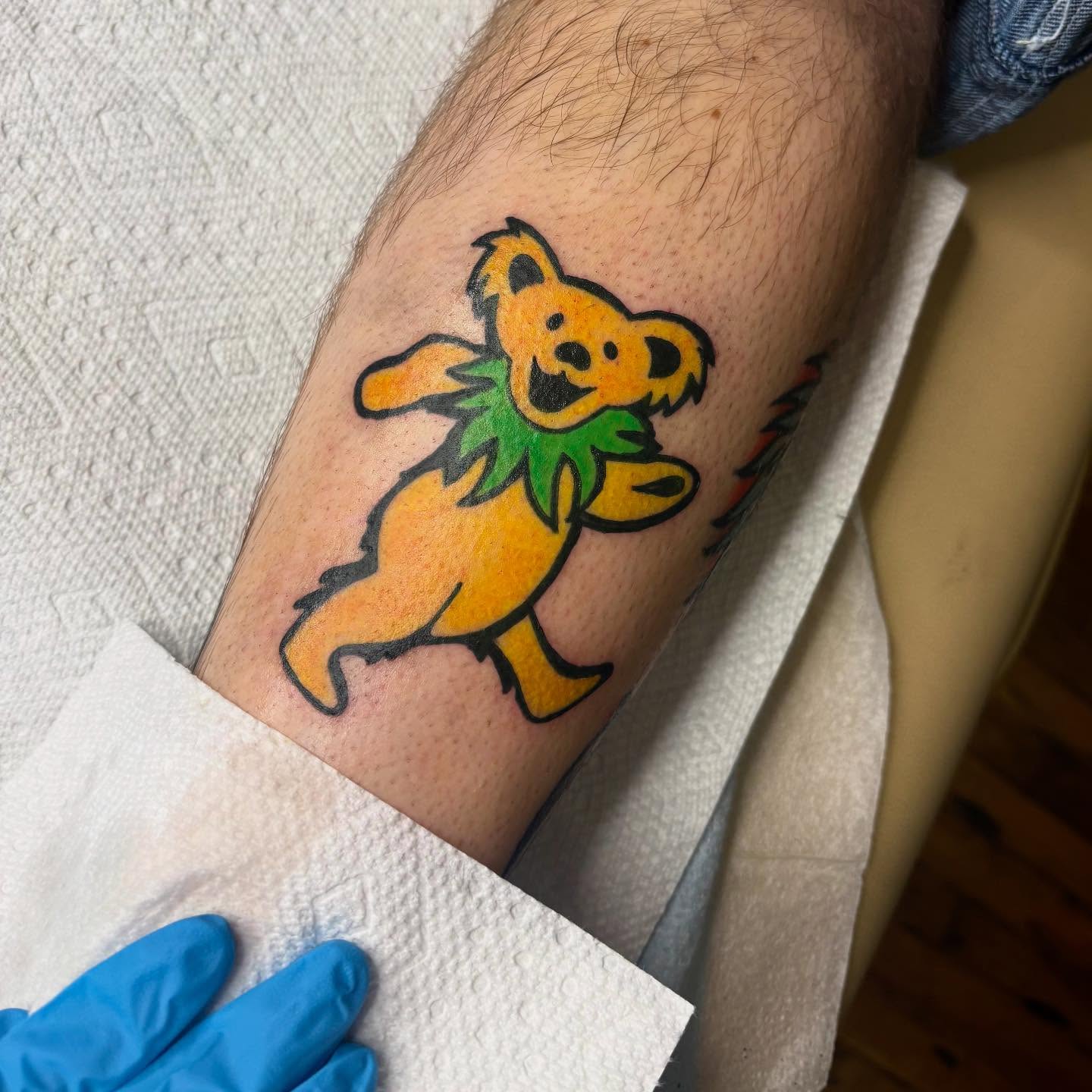 Grateful Dead bear new school tattoo on the forearm by Emmy Gallagher