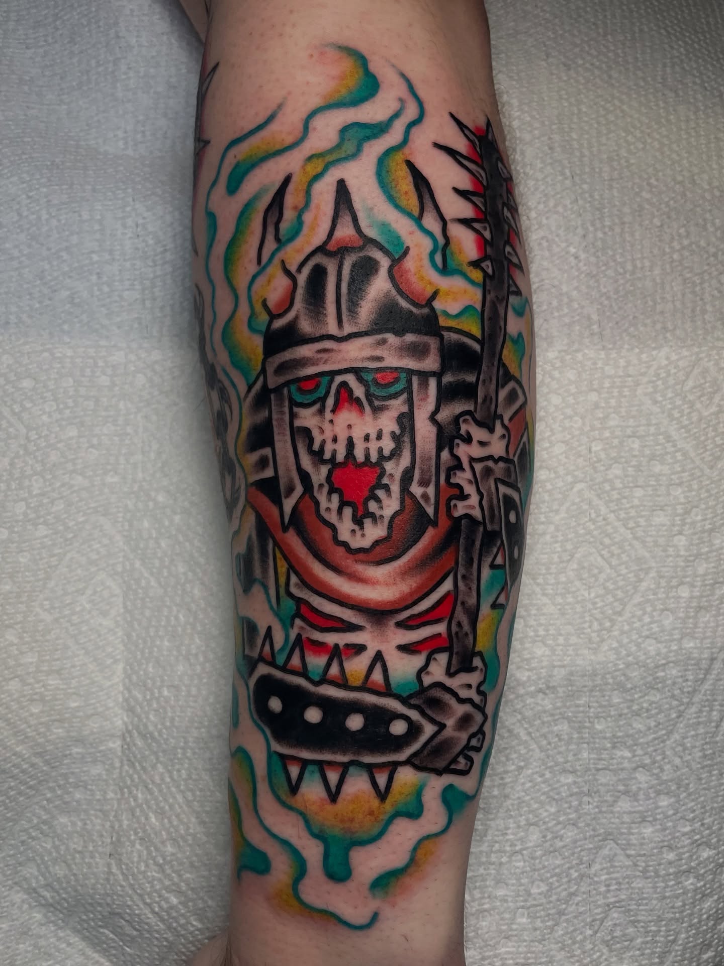 Skull with helmet American traditional tattoo on the forearm by David Armacost, Cincinnati, Ohio
