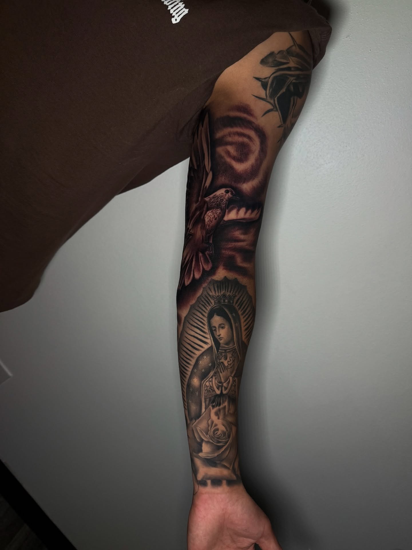 Our Lady of Guadalupe realism tattoo on the forearm by Aaron Saenz jr