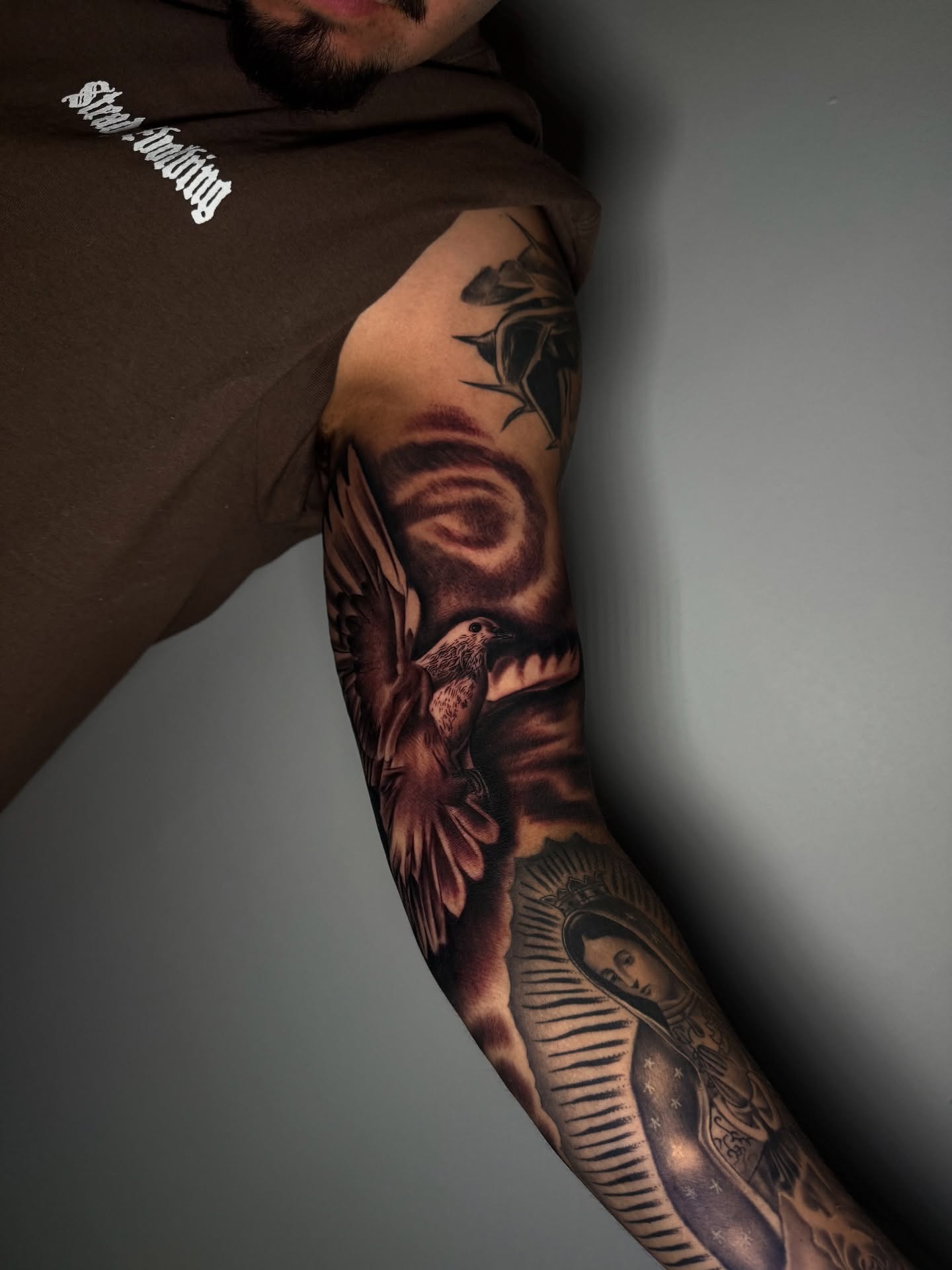 Religious iconography realism tattoo on the forearm by Aaron Saenz jr