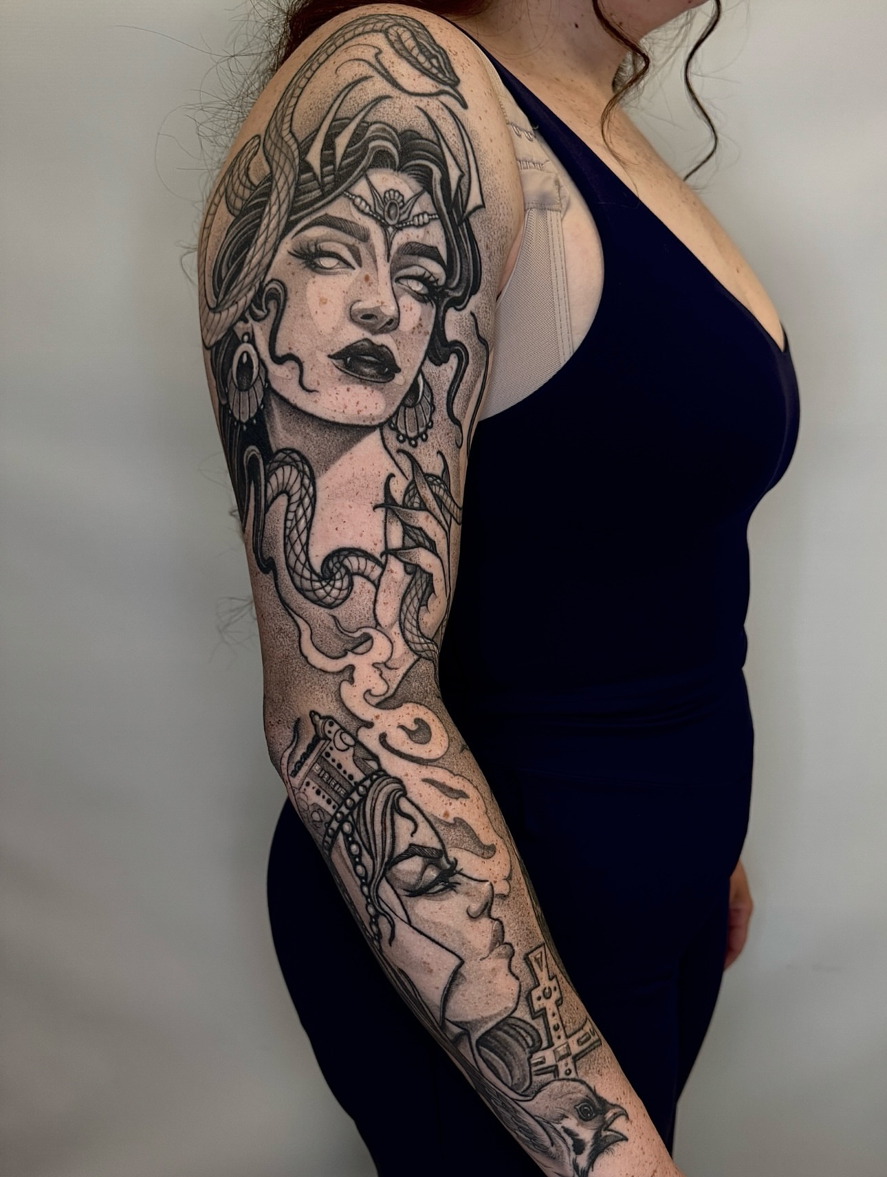 Woman with snakes dotwork tattoo on the upper arm by Las Vegas Tattoo Artist