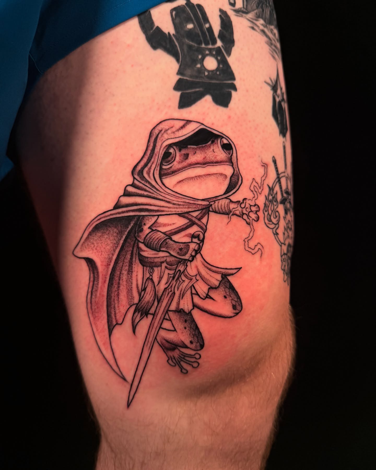 Frog in cloak realism tattoo on the thigh by alex h🪴 neotrad