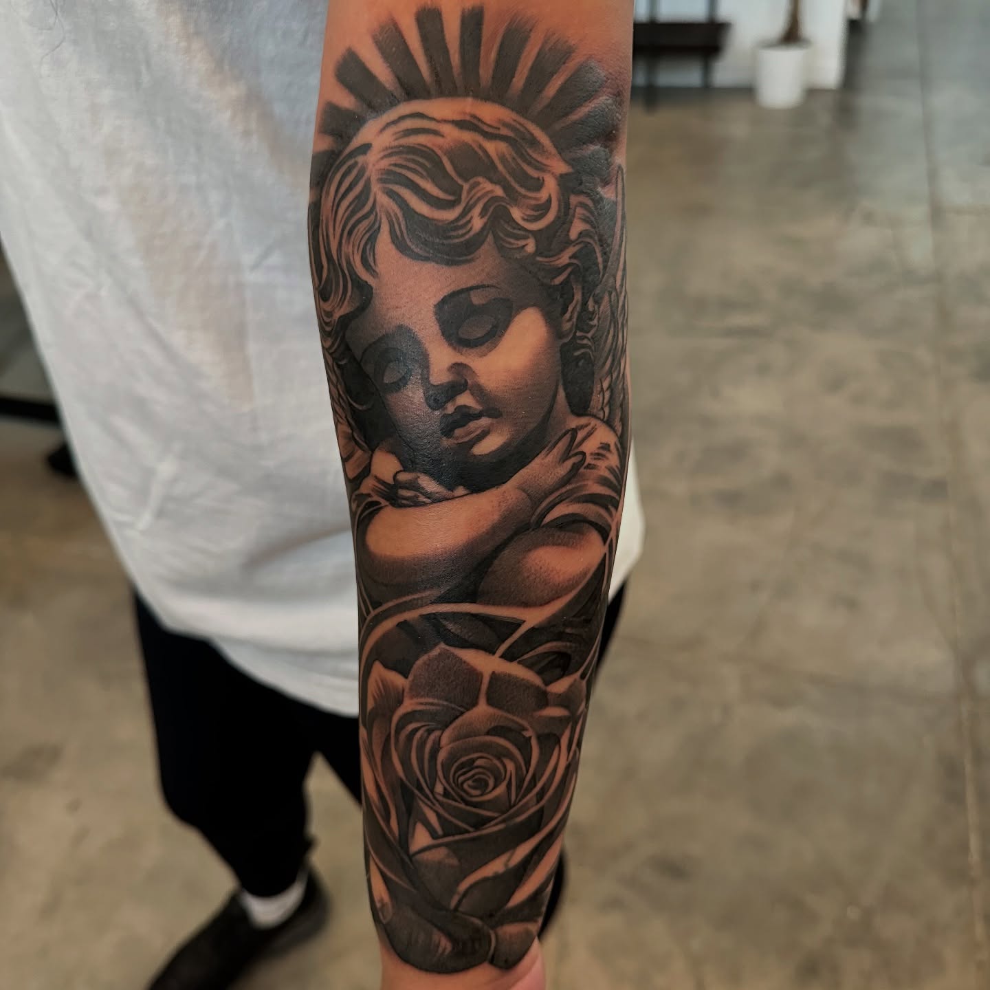 Child with rose realism tattoo on the forearm by Bigtoons21