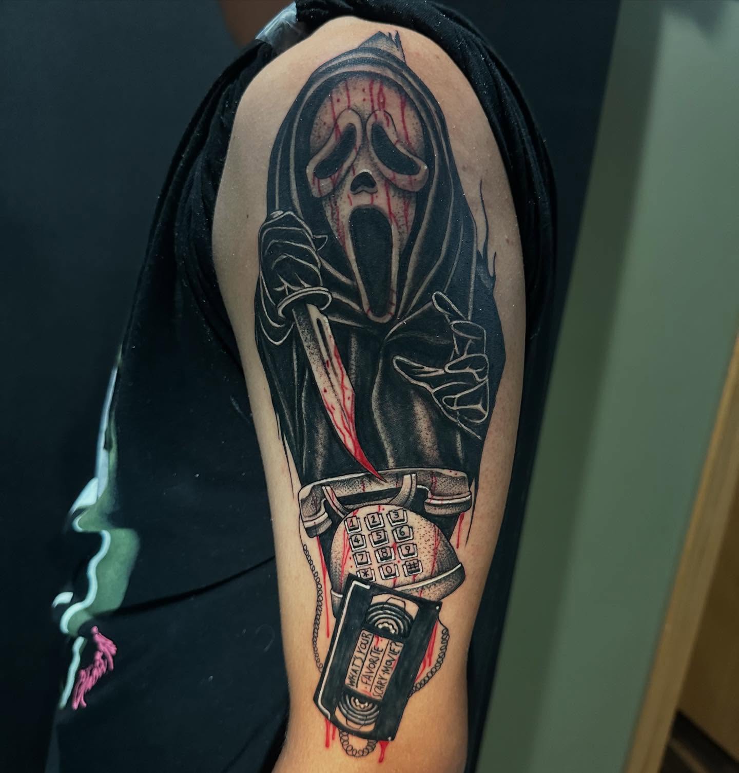 Mask with knife dark realism tattoo on the forearm by George Zabala, Rockdale, Illinois