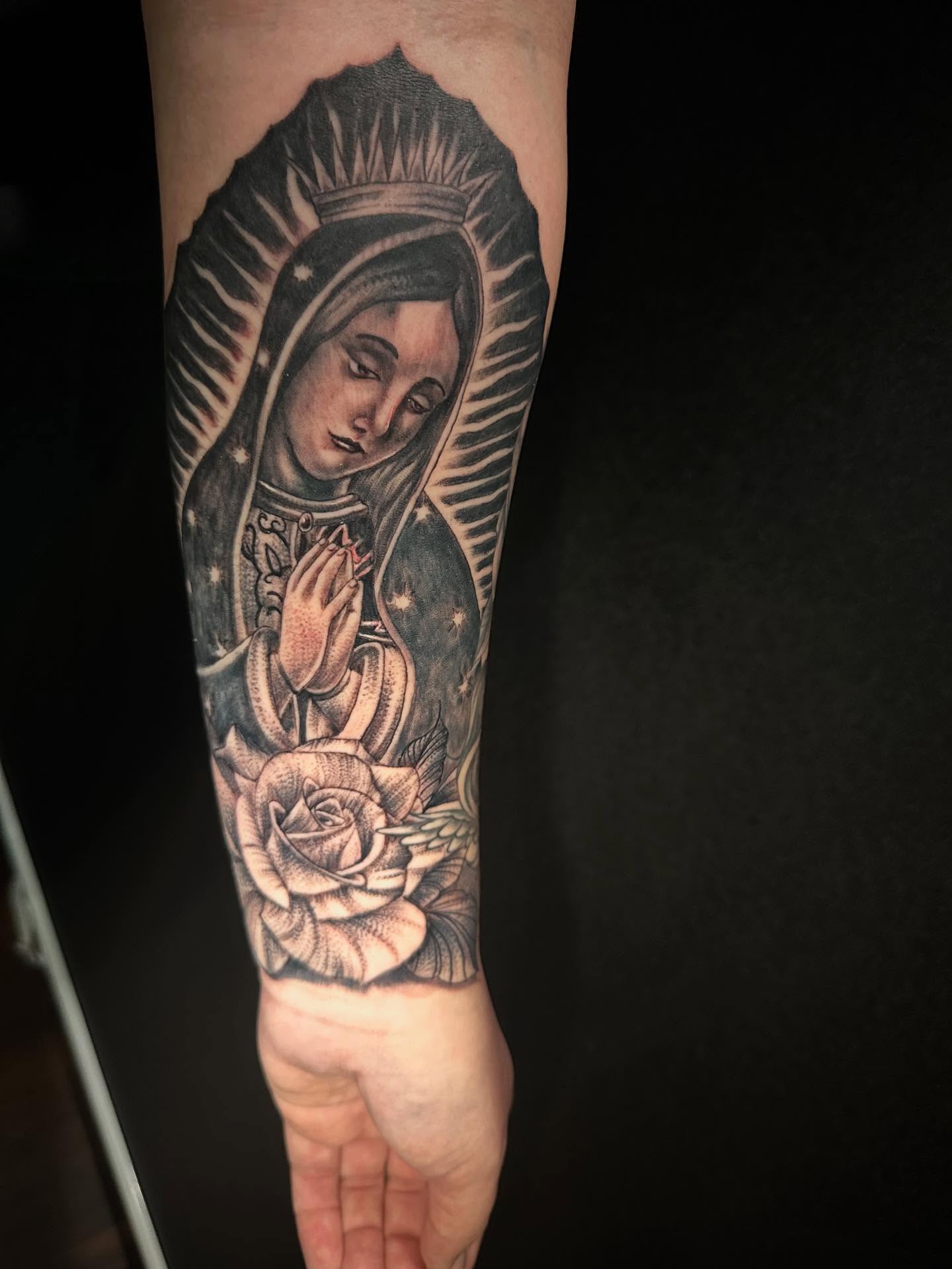Virgin mary black and grey tattoo on the forearm by George Zabala, Rockdale, Illinois