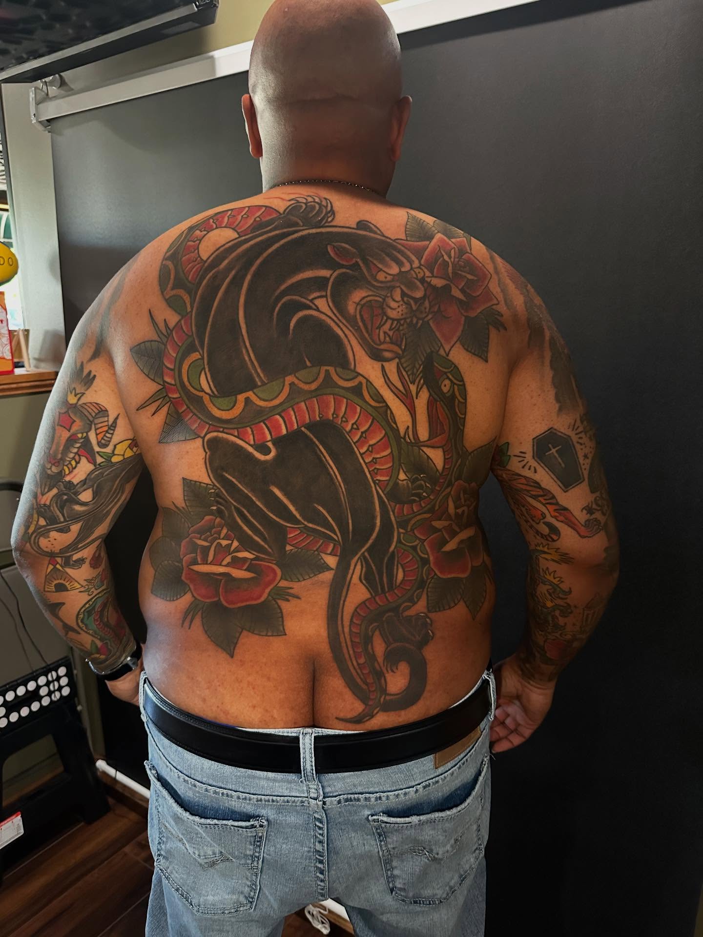Snake and peony American traditional tattoo on the back by George Zabala, Rockdale, Illinois