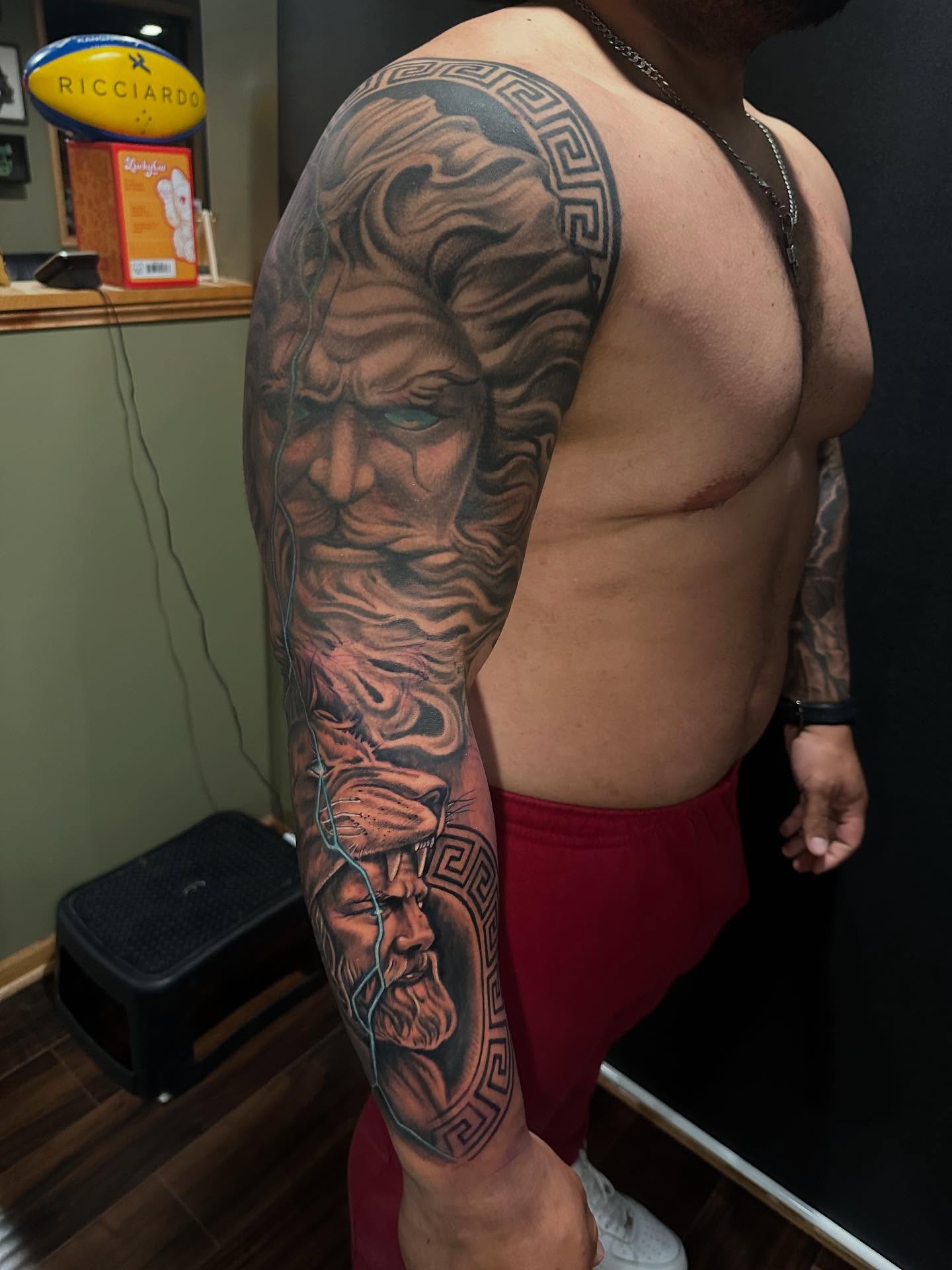 God-like faces realism tattoo on the upper arm by George Zabala, Rockdale, Illinois