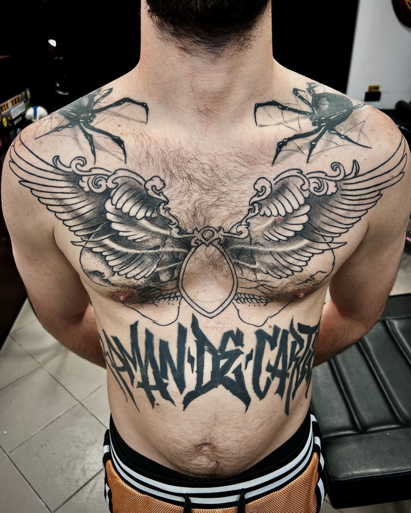 Wings and spiders geometric tattoo on the chest by Comastein__________✍🏼️