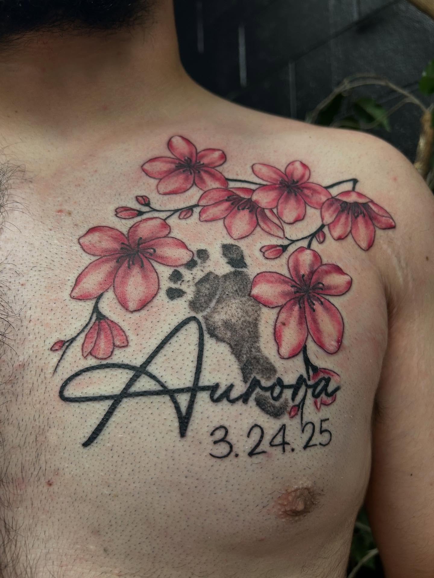 Cherry blossoms and name dotwork tattoo on the chest by Josh Williams, Chattanooga, Tennessee