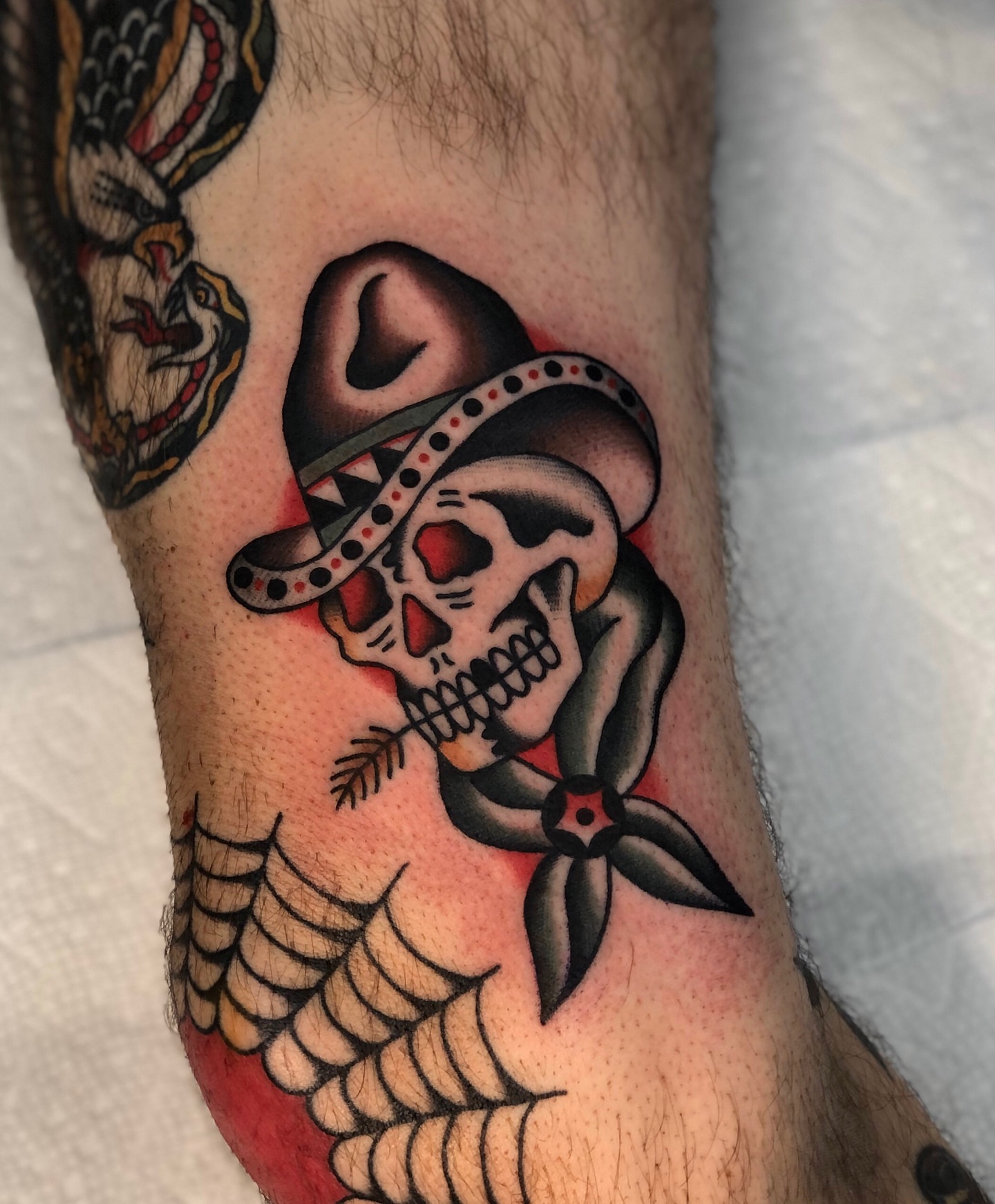 Skull wearing sombrero American traditional tattoo on the forearm by EVA Traditional Tattoos