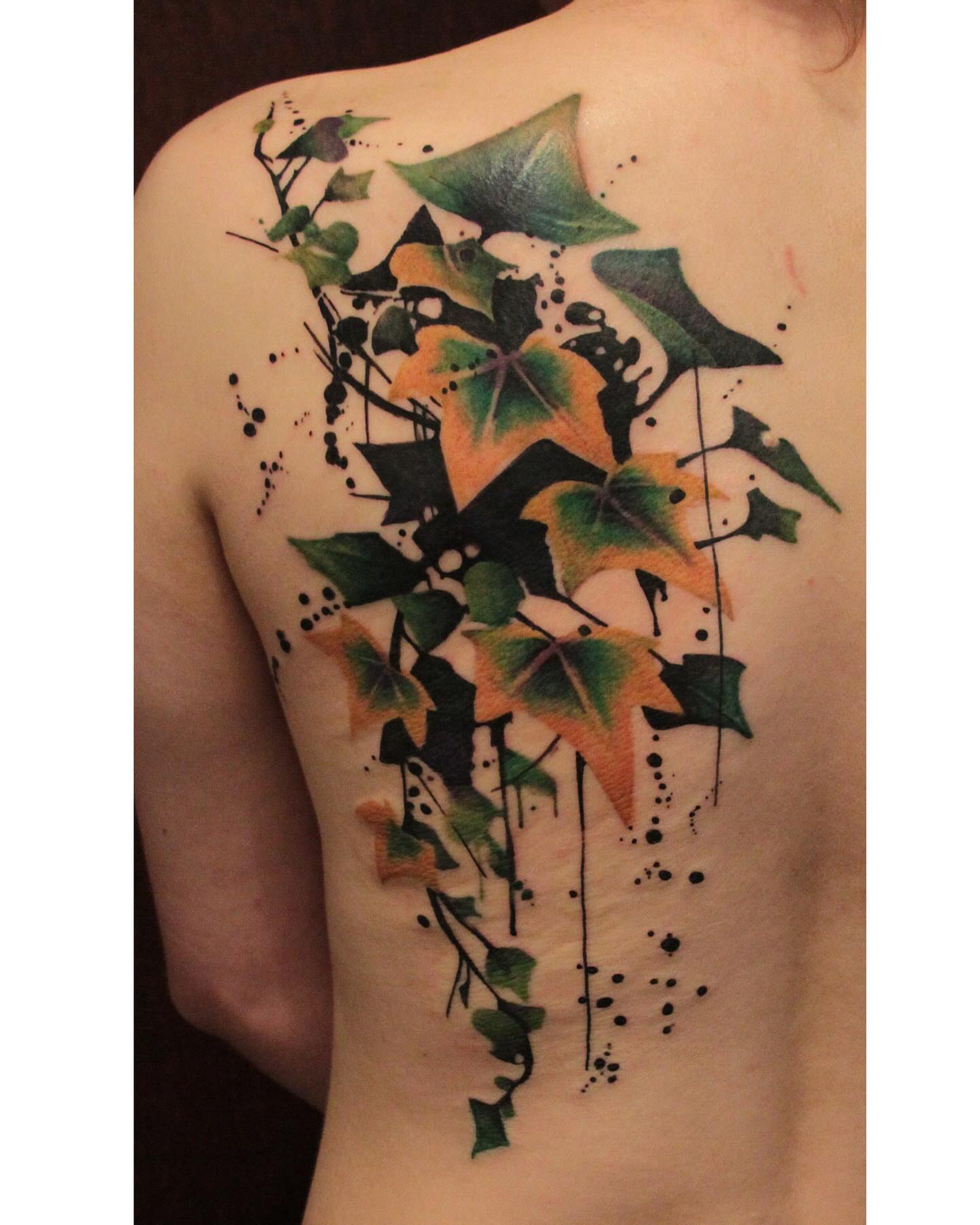 Ivy leaves watercolor tattoo on the back by Gene Coffey, New York, New York