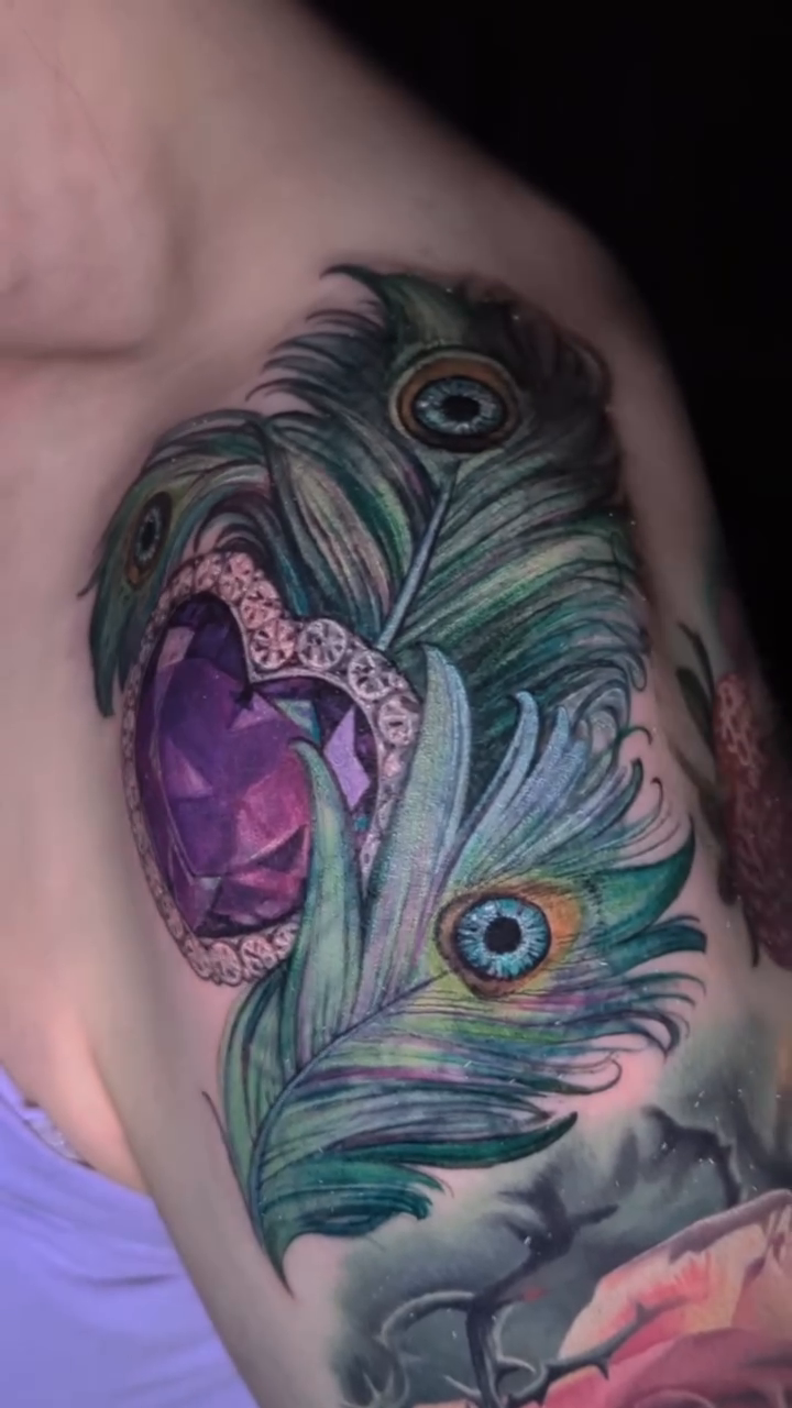 Amethyst heart with peacock feathers realism tattoo by 💎 Neon
