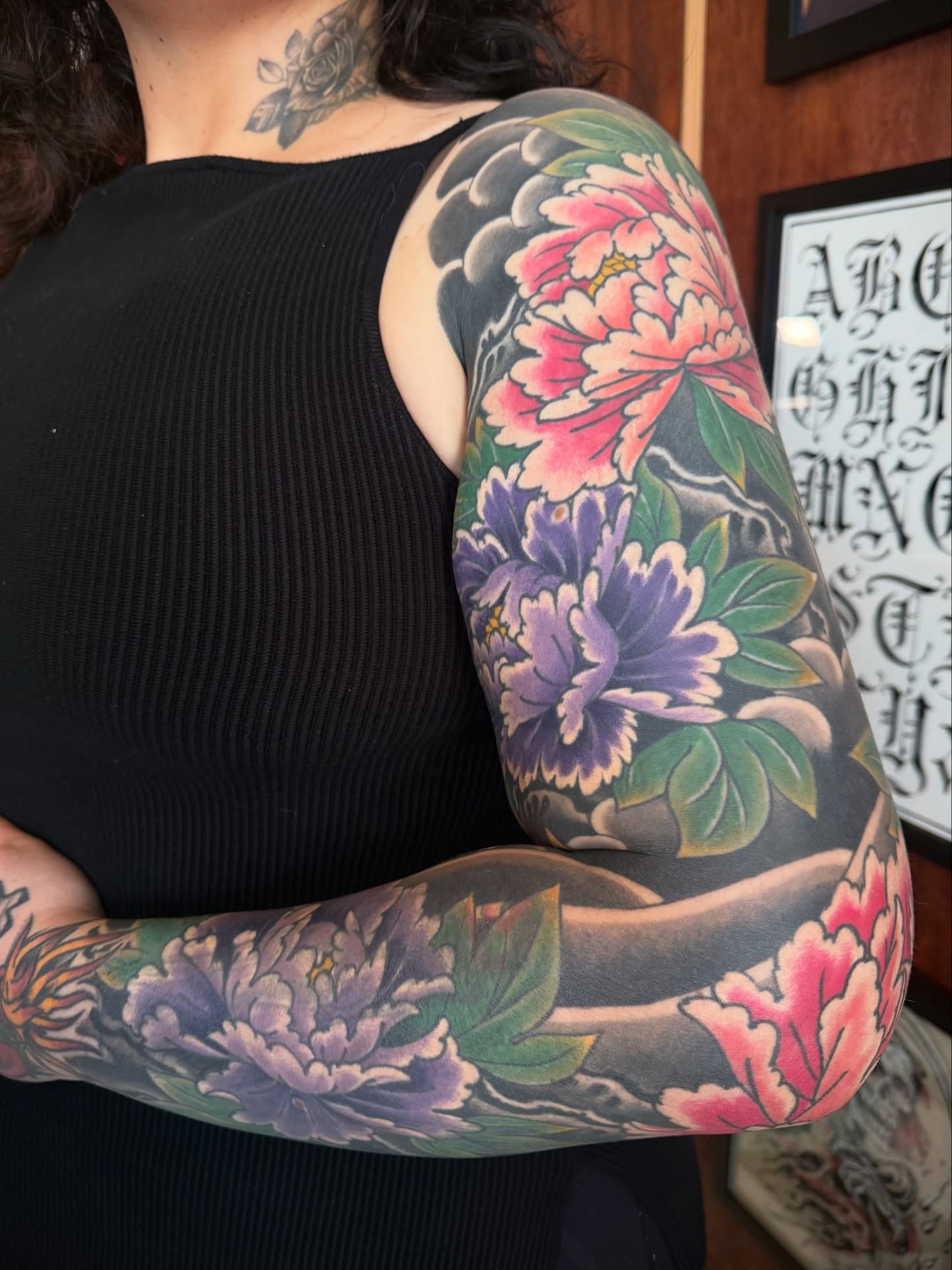 Peony flowers japanese irezumi tattoo on the upper arm by Candi Kinyōbi