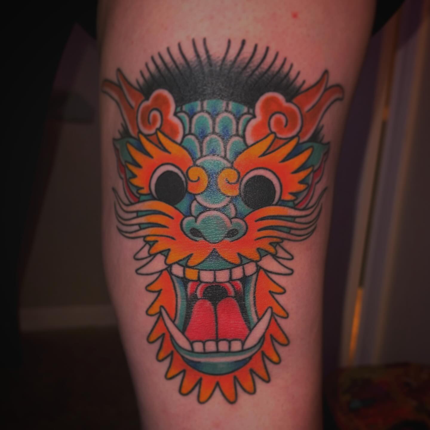 Dragon head American traditional tattoo on the forearm by Kayla Shoffner