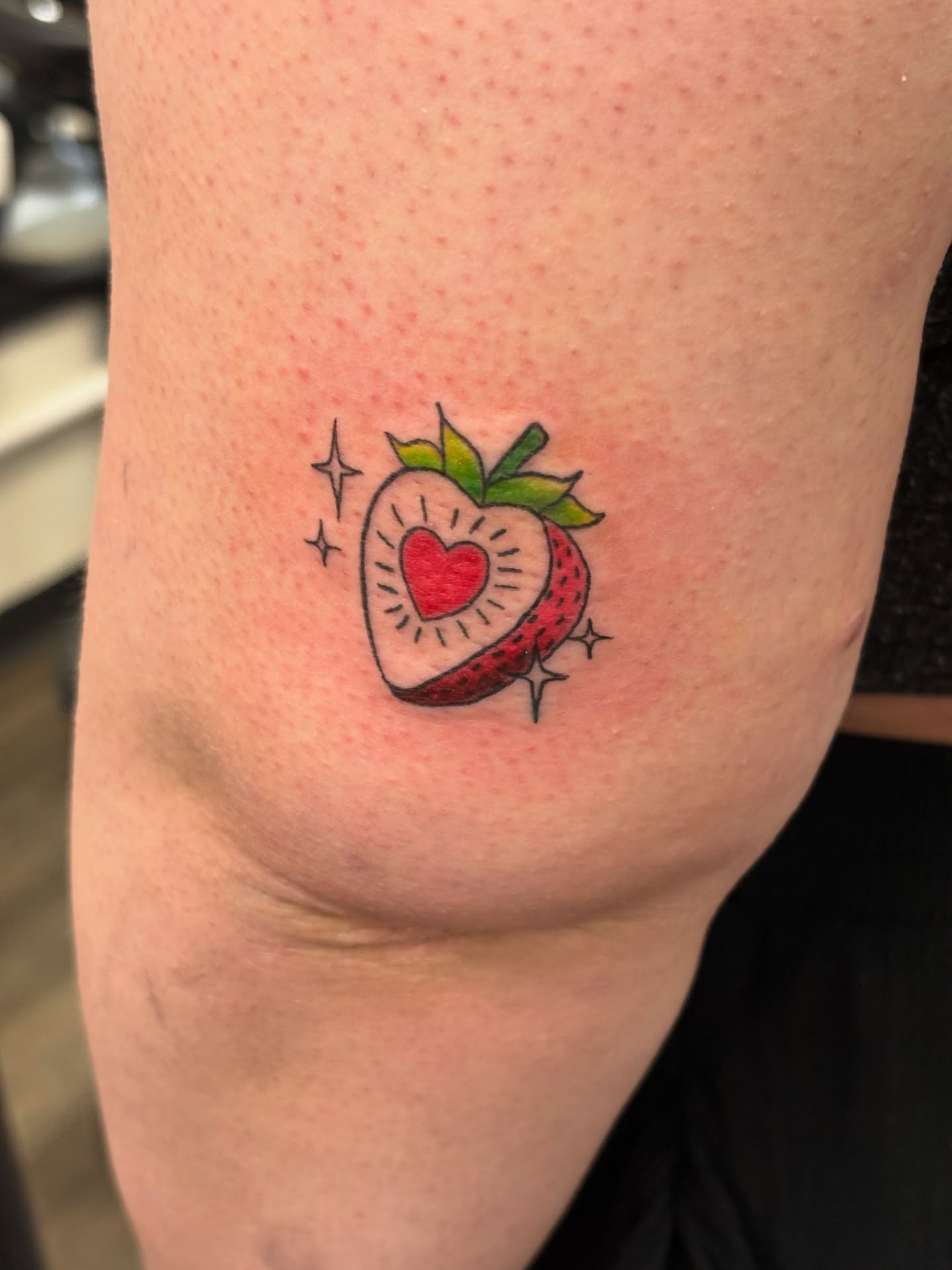 Strawberry American traditional tattoo on the forearm by Tori Anderson, Minneapolis, Minnesota
