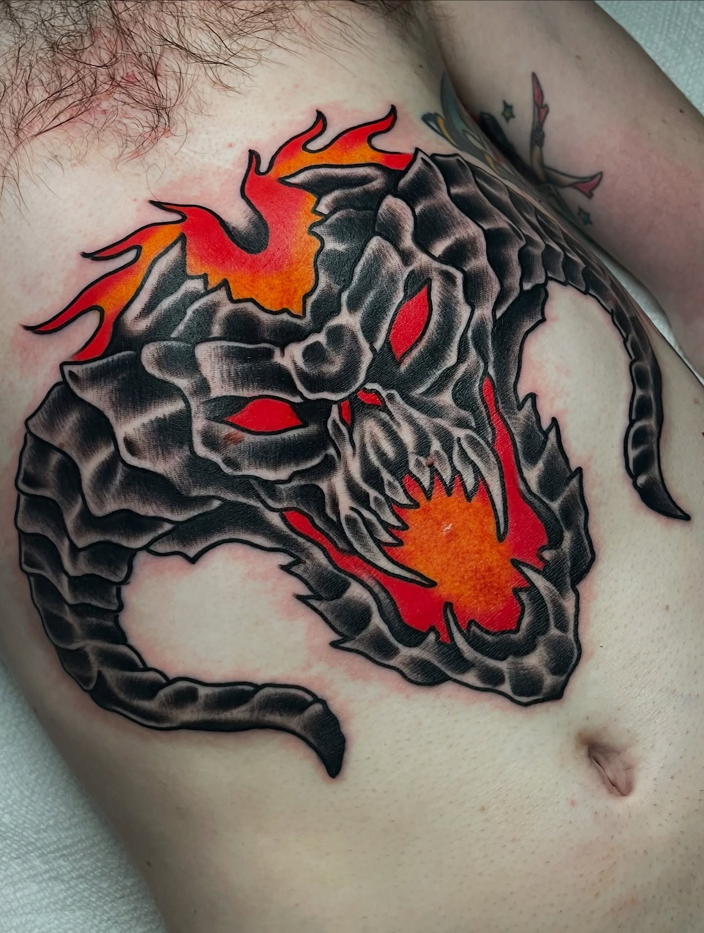 Dragon American traditional tattoo on the chest by David Armacost, Cincinnati, Ohio